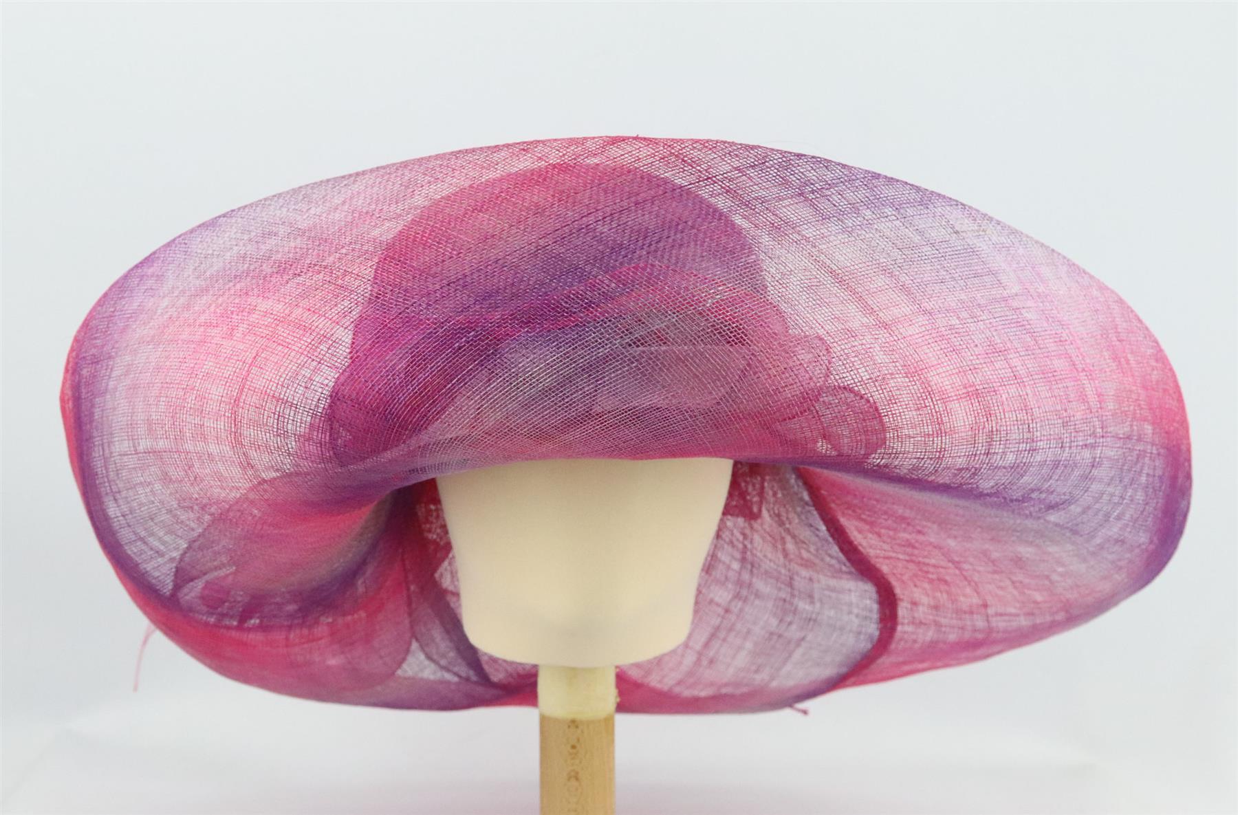This hat by Marzi from Harrods is made from pink and purple sinamay straw and organza in a structured sweeping silhouette and finished flowing detail along the front. Pink and purple straw, pink organza. Slips on. 100% straw. Comes with box.