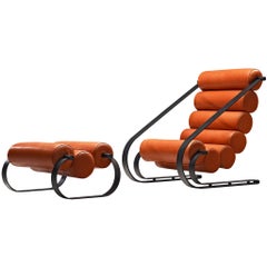 Fauteuil de salon Balestra de Marzio Cecchi avec pouf en cuir orange feu