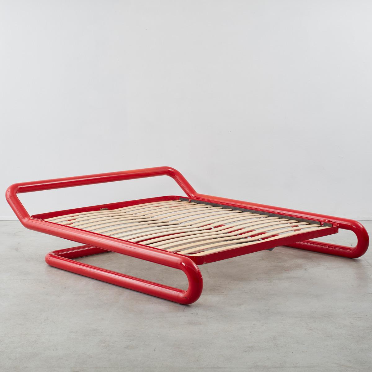 Rare red enamel cantilever bed frame by visionary architect Marzio Cecchi (b1940 – 1990). Produced by his design practice Studio Most, his pieces were limited run made-to-order, and so are highly scarce and collectible. Cecchi could be said to be a