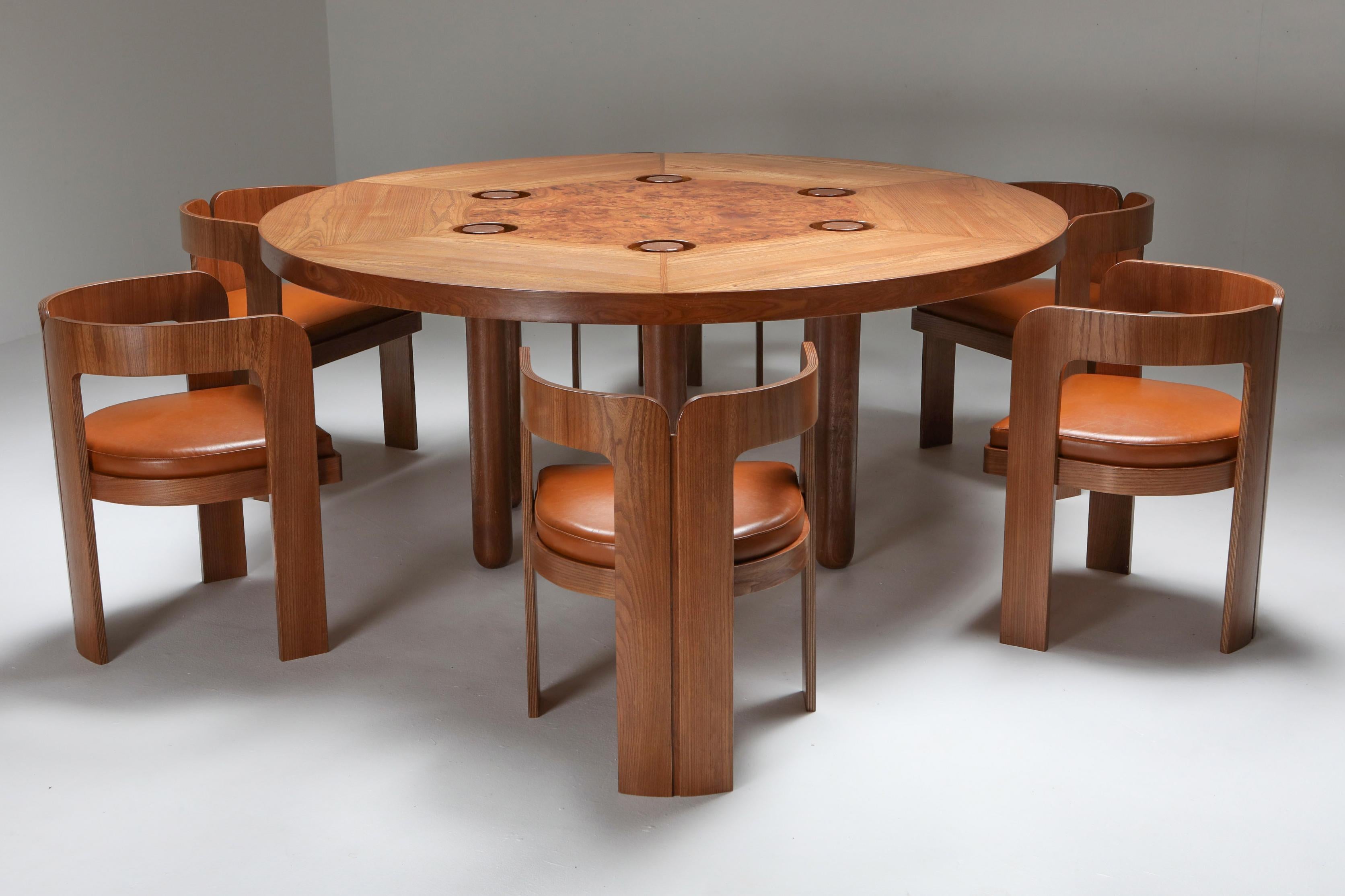 Italian design round dining table and armchairs by Marzio Cecchi, walnut, burl

The chairs fit perfectly underneath the tabletop.

Marzio Cecchi was interior designer, architect, furniture designer. Artist.
He made everything custom for his