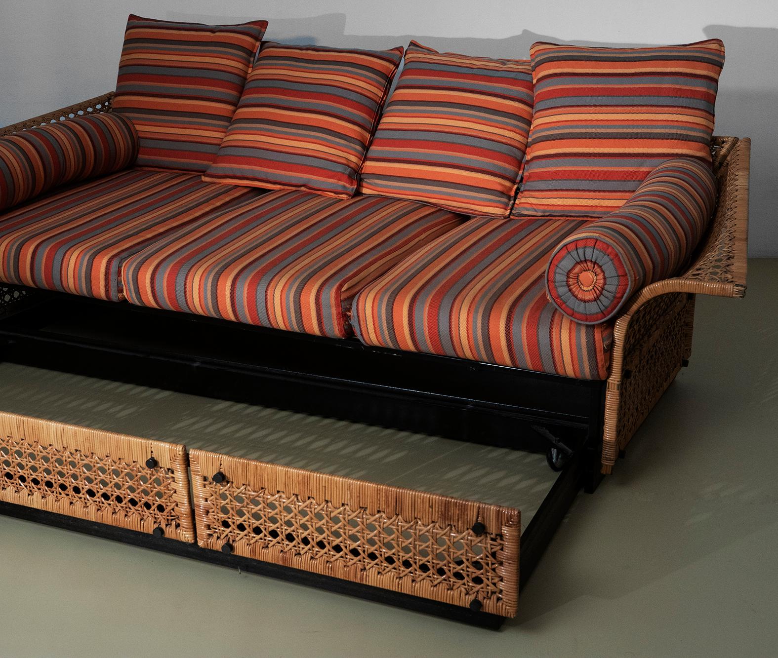 Marzio Cecchi, Sofa Bed
Sofa with pull-out bed, metal and guinea cane frame with cushions upholstered in striped fabric.
Production Italy, circa 1965

Dimensions are: 
W101xL255.5xH69 cm
with the bed open W183.5xL255.5xH69 cm
