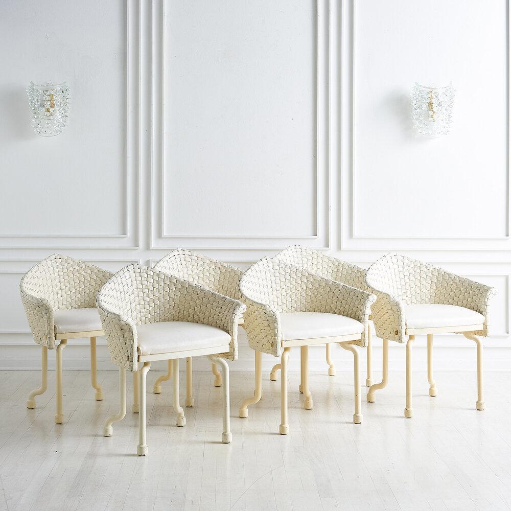 These unique dining chairs were designed by Italian architect Marzio Cecchi. Cecchi designed them as a custom product, along with all of the furnishings, or the lobby of a spa hotel in Northern Italy.  (note picture only shows 6 but we have 8