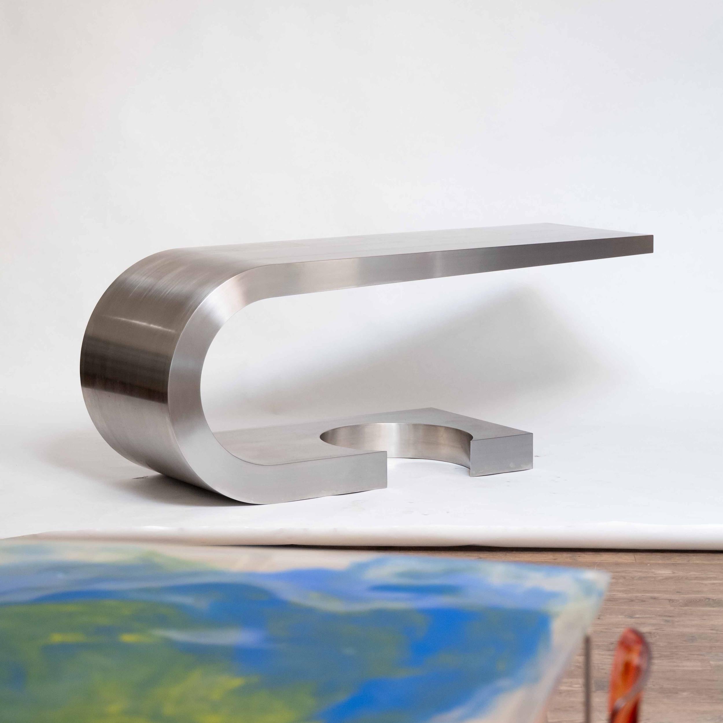 DIAPASON DESK
MARZIO CECCHI FOR STUDIO MOST C.1968

1 of 40 made - The Diapason desk by Marzio Cecchi for Studio Most. This sculptural piece is constructed out of solid stainless steel, featuring a cantilevered and tapered form. Suitable for use as