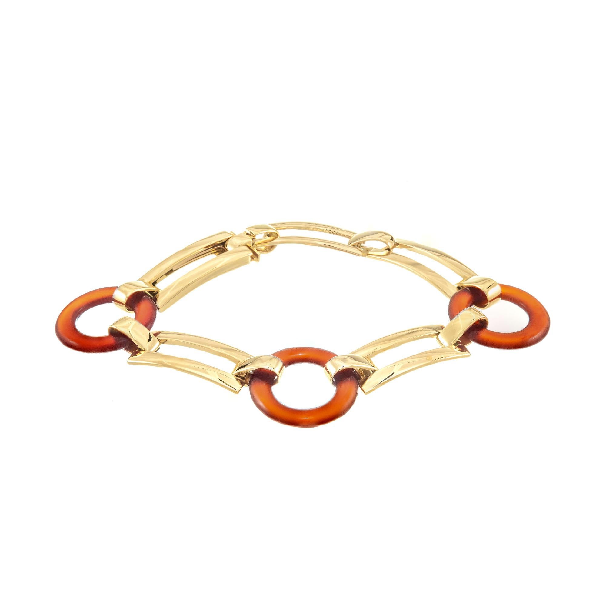 1930's Marzo Paris bracelet in 18k yellow gold with natural carnelian open circle links

3 round orange open carnelian discs 20.7 x 4.4x 2.78
18k yellow gold 
Stamped: Marzo Paris 
Hallmark: eagle hallmark
30.8 grams
Bracelet:  8 Inches

