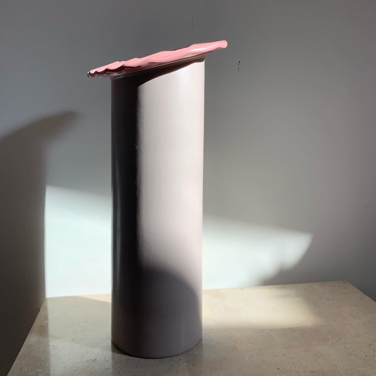 A monumental pink postmodern Memphis Milano style cylindrical ikebana vase with squiggle collar, late 20th century. Signed by artist Masa Mami. One flaw slide 9; otherwise flawless.
 