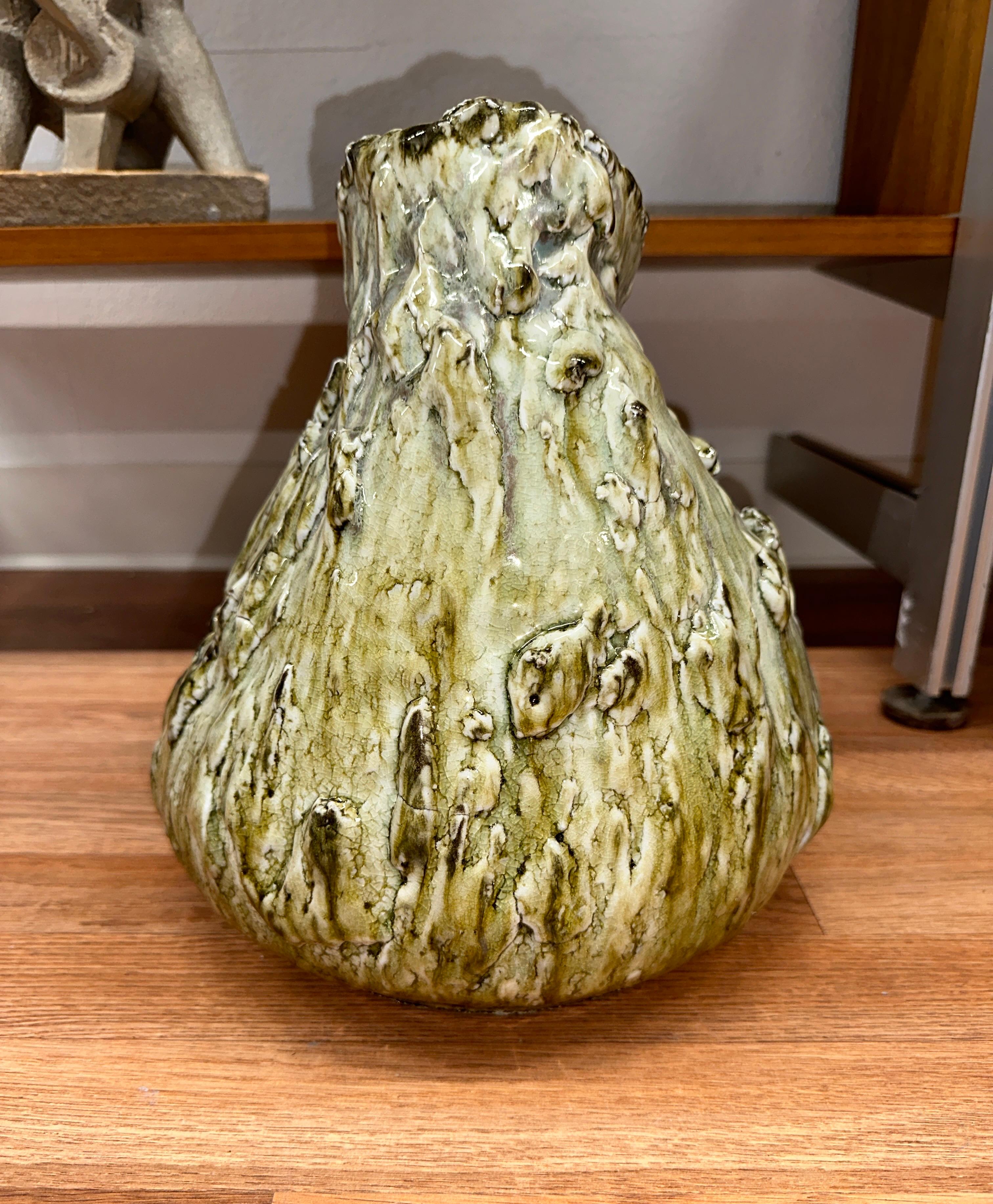 Beautifully glaze and formed piece of ceramic pottery signed Masaaki 2011 on the base. Stunning colors in shades of greens. In good condition, with some glaze imperfections inherent to the firing process. 