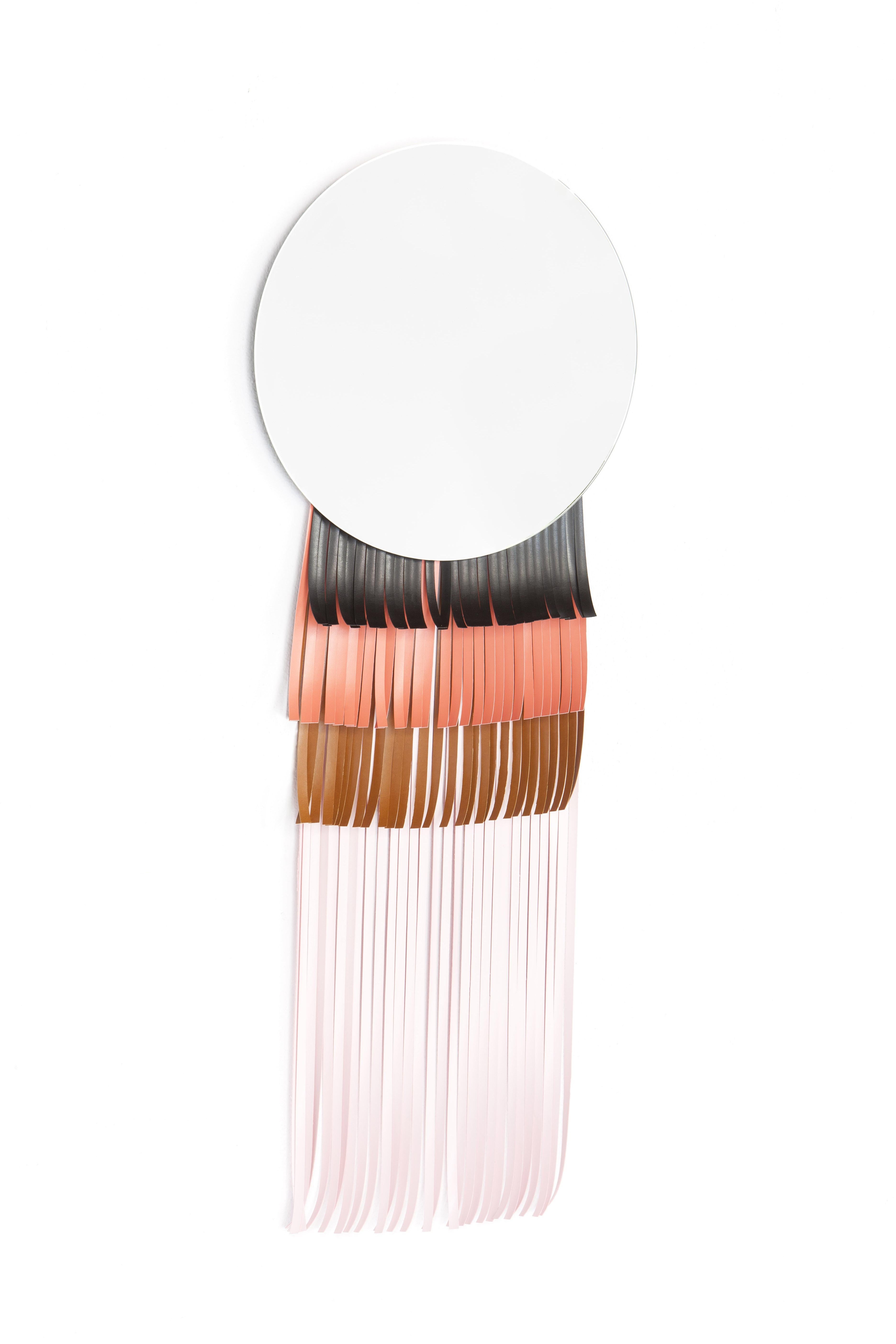 Masai round mirror by Serena Confalonieri
Dimensions: diameter 42 cm
Materials: Mirror and faux leather decorations
Faux leather colors: Black, salmon, natural brown and pink

Round mirror with faux leather decorations.

Serena Confalonieri