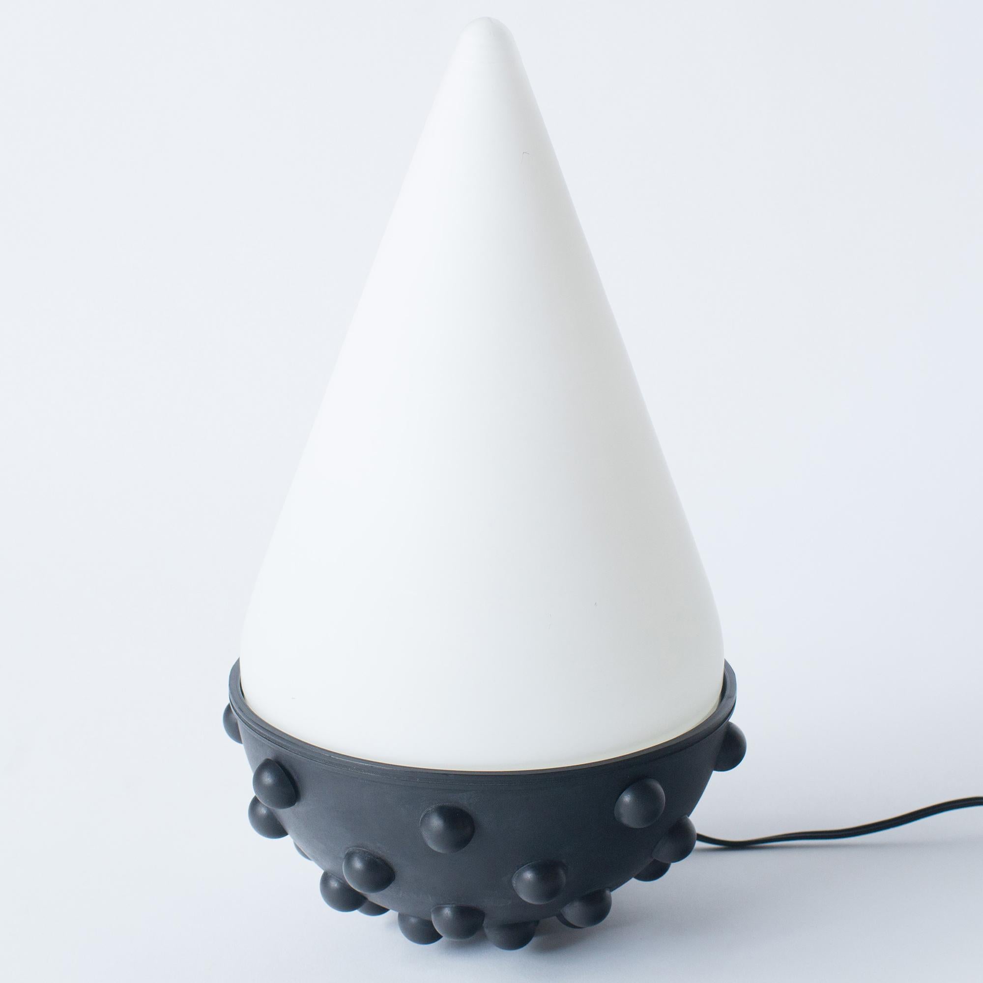 Umeda Stand
Designed by Umeda Masanori in the 80s. Manufacture is Yamagiwa, JAPAN. 
The protrusions act as stoppers. This lamp can stay in several positions. 
There is no chips or cracks on glass shade. It's good vintage condition.

E27 light bulb.