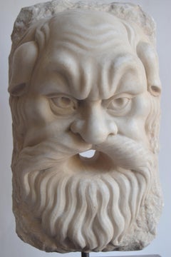 Theatrical mask of satyr carved on white Carrara marble -made in Italy
