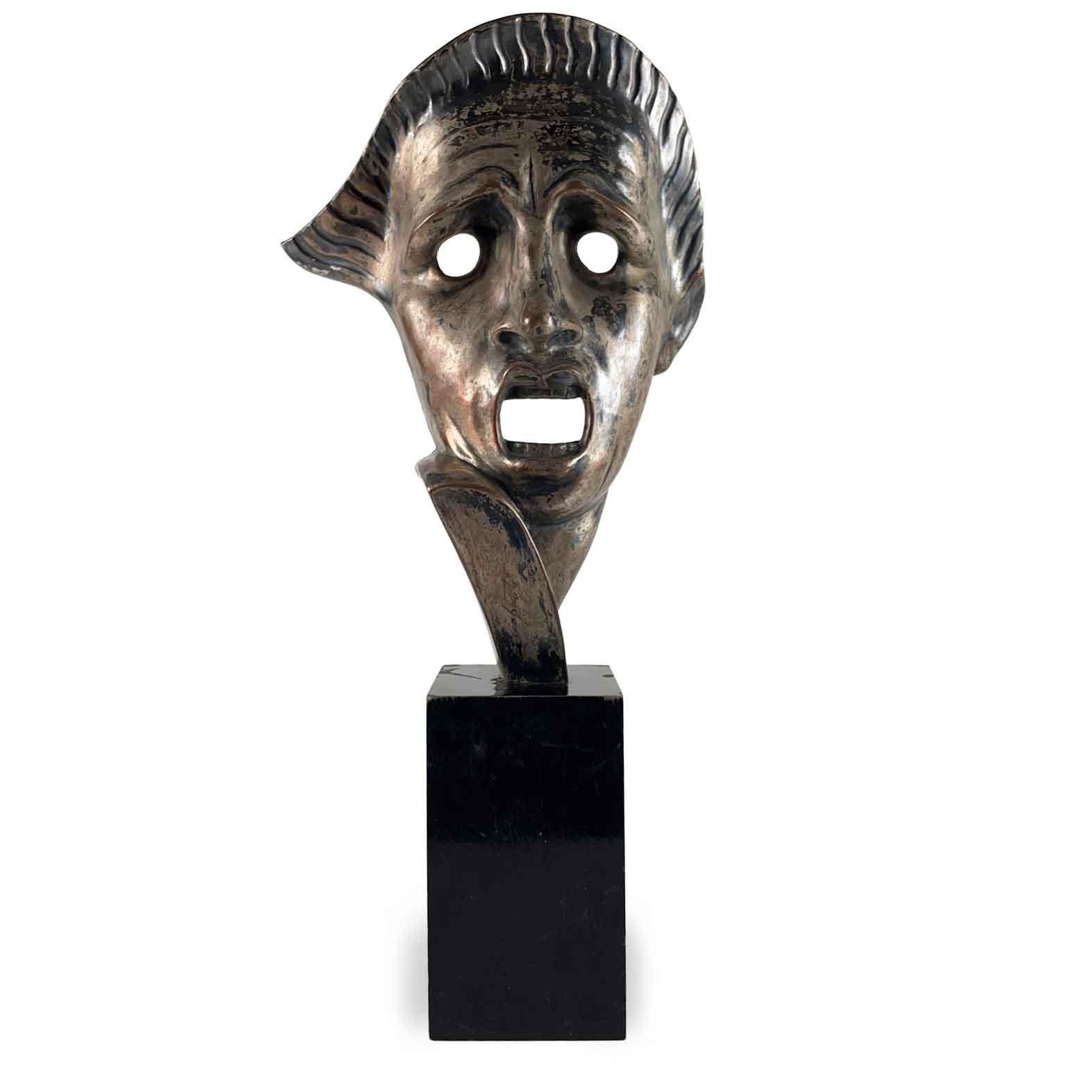 Cacciapuoti Tragic Mask, Italian Art Dèco figurative sculpture by Neapolitan artist Guido Cacciapuoti  (Naples 1892- Milan 1953) depicting a tragic mask, made of ceramic, hand-molded and silver-plated  on the front.
The sculpture is signed