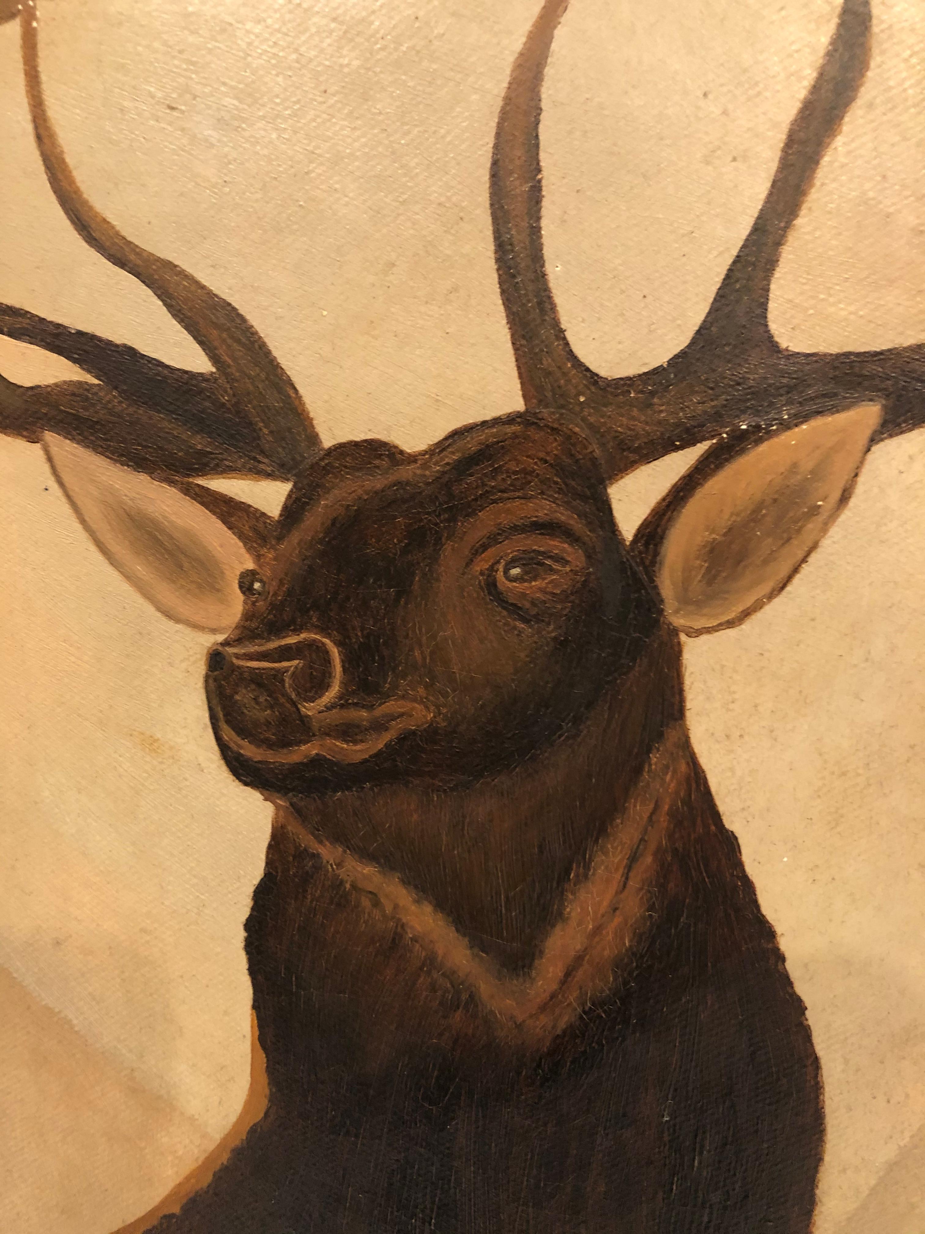 Handsome masculine painting from the late 19th century of a proud buck deer with huge antlers striking an imposing pose. Moody color palette of taupe, grey, brown and mossy green. Signed in pencil on the back, Leslie Maine, but we don't know if that