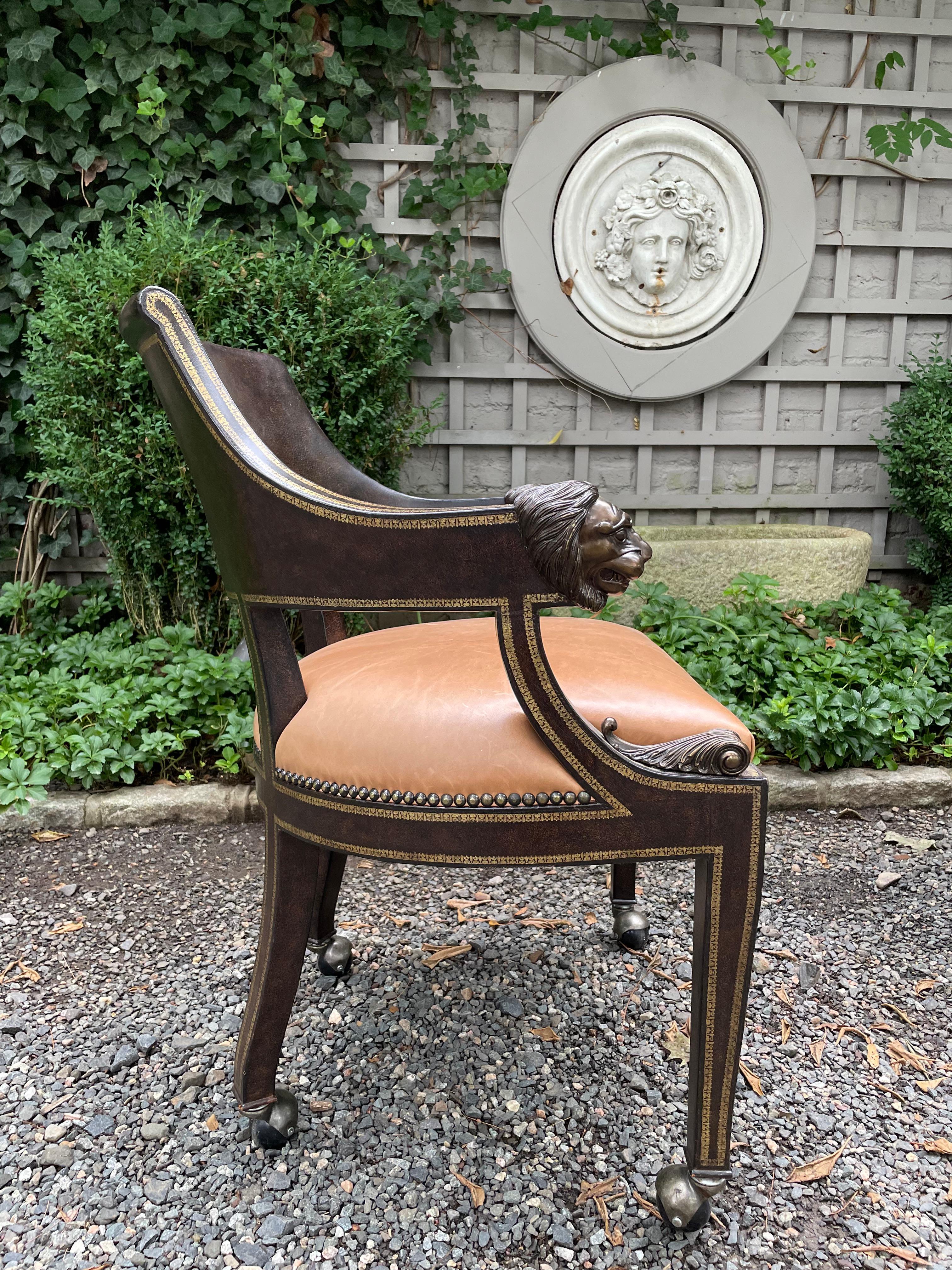 Masculine Pair of Leather Embossed Armchairs with Bronze Lion Arm Rests 6