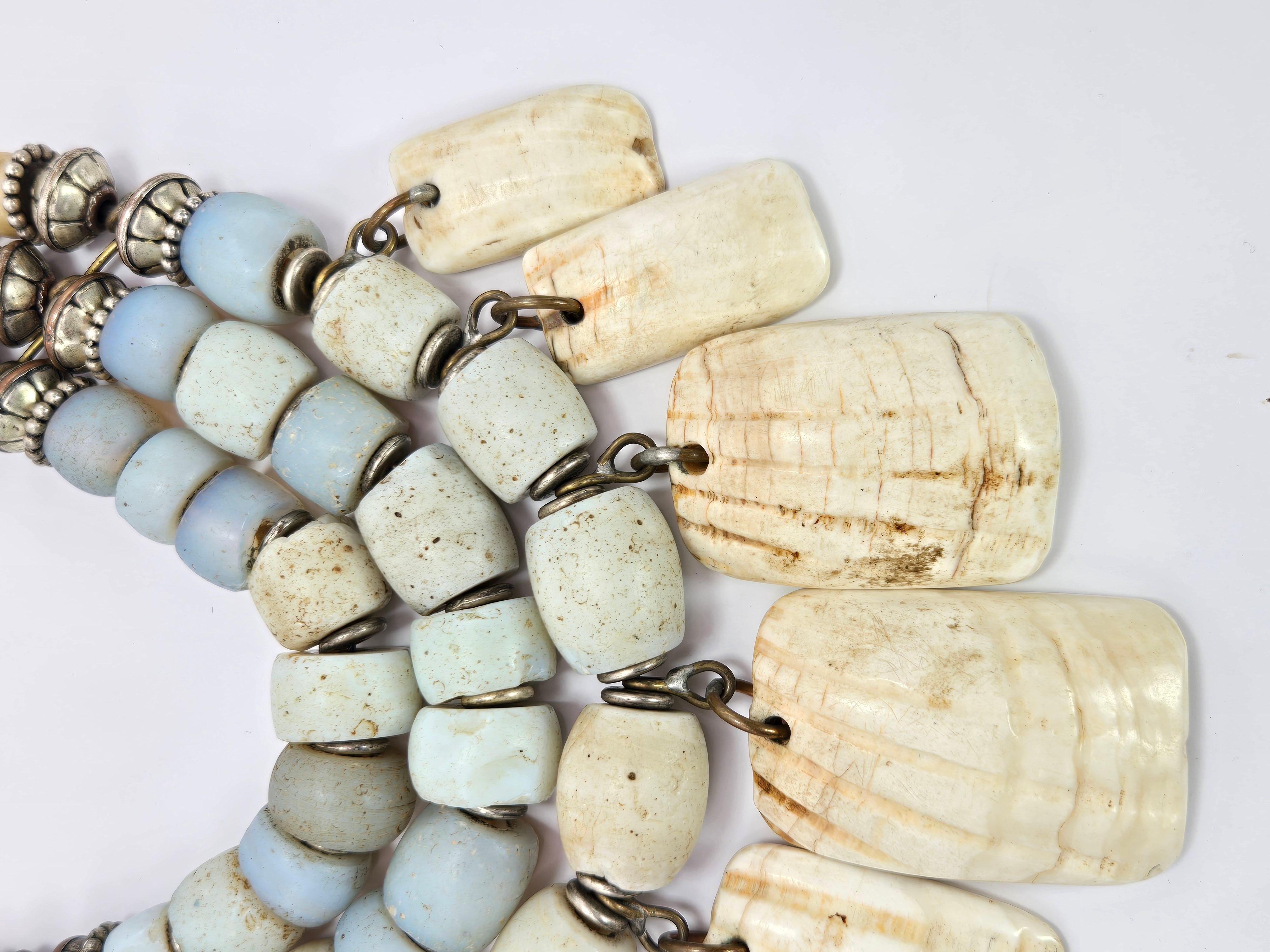 This Masha Archer necklace is unique and dramatic, made of elements that she gathers from all over the world. 

The beads include 