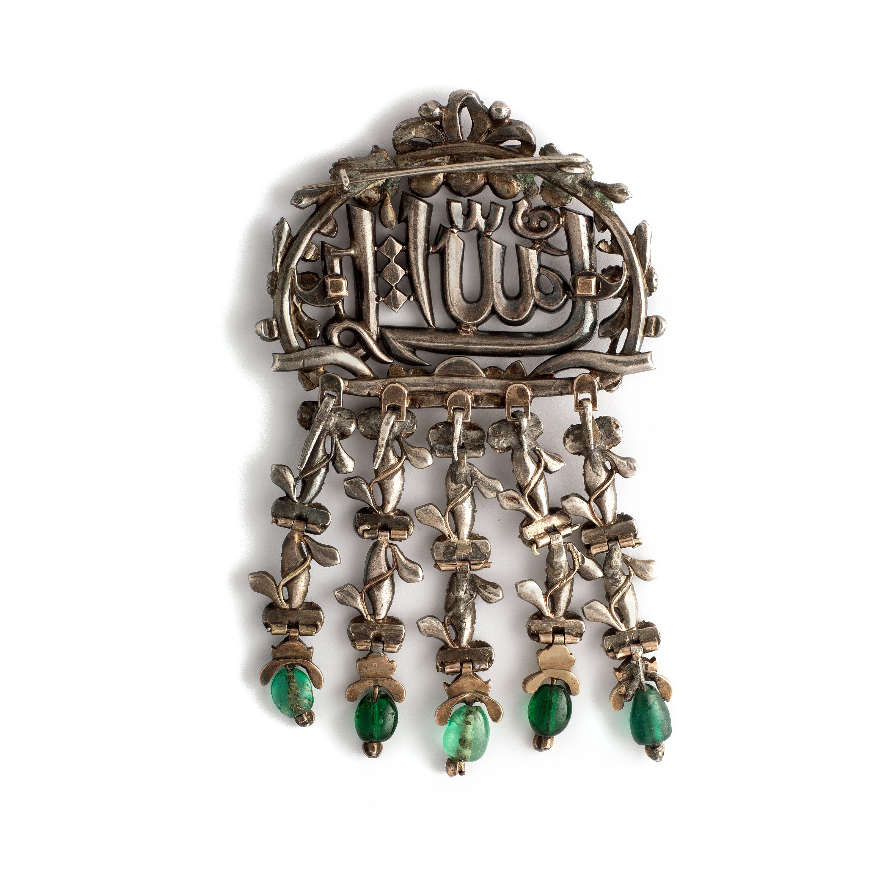Impressive Stomacher Brooch set by Rose cut Diamond on silver and gold.
Five Emerald Beads pending.

Arabic inscription for 