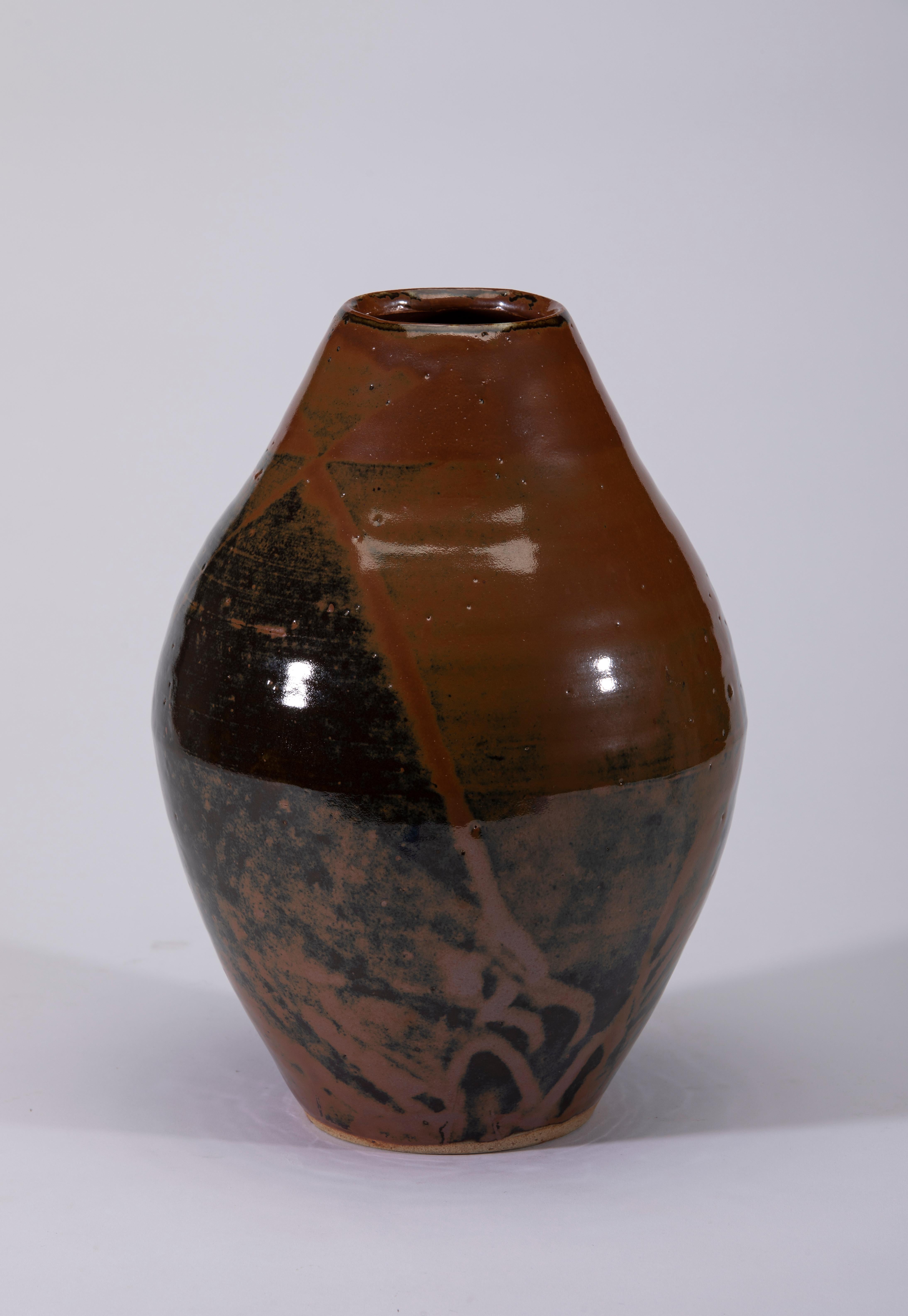 A beautiful Mashiko Ware Vase with a deep brown, rust and black design.
The clay in the Mashiko region is a pure from of clay in silicon acid and iron which produces the wonderful deep color combined with a fabulous glaze. 
Mashiko Pottery is wabi