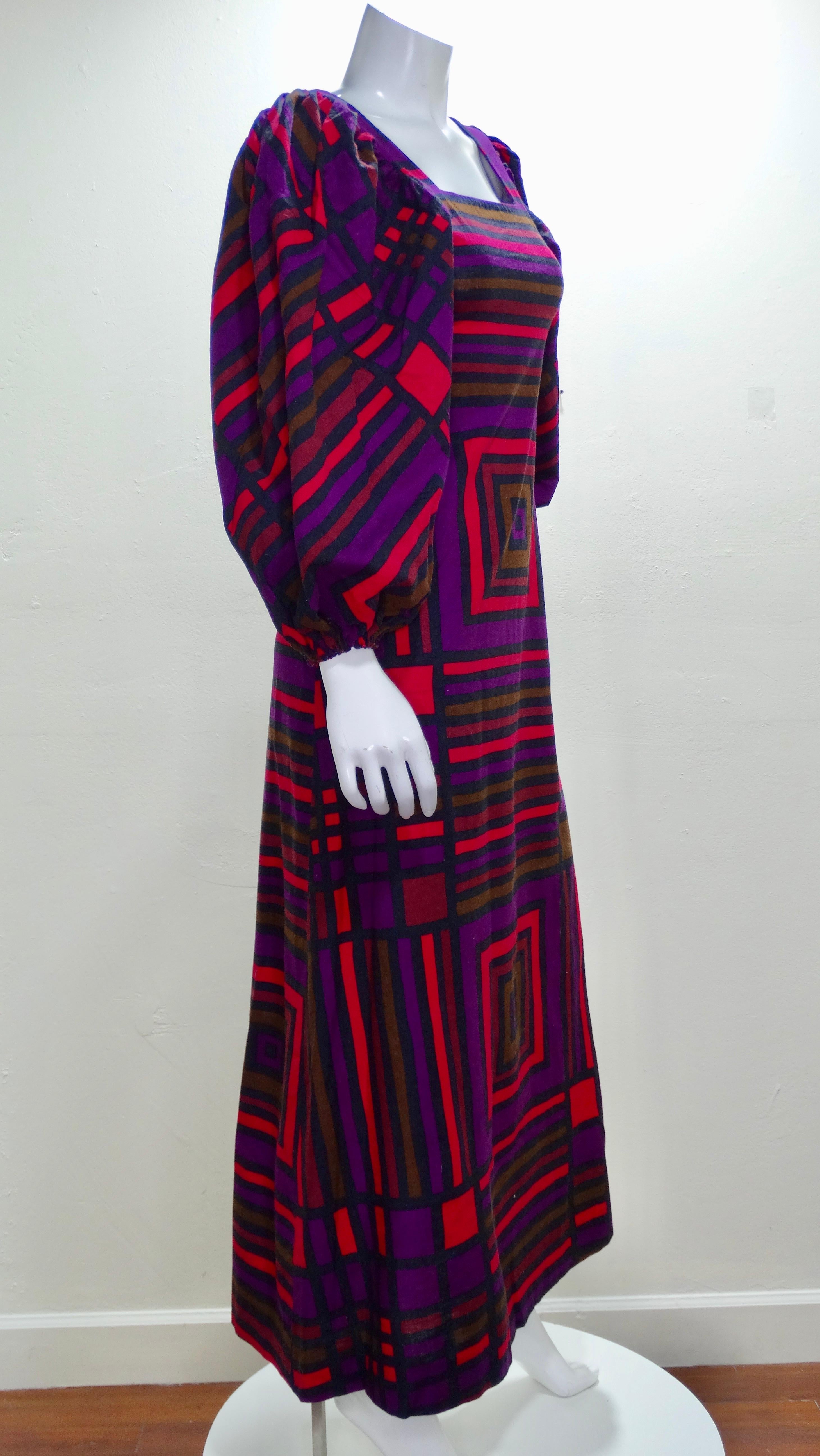 Your perfect dress has arrived and it does not disappoint! This Maskit maxi dress circa 1970's is made of light weight cotton and printed all over with a multi-colored geometric pattern, square neck line and billowy cuffed sleeves. Back zipper
