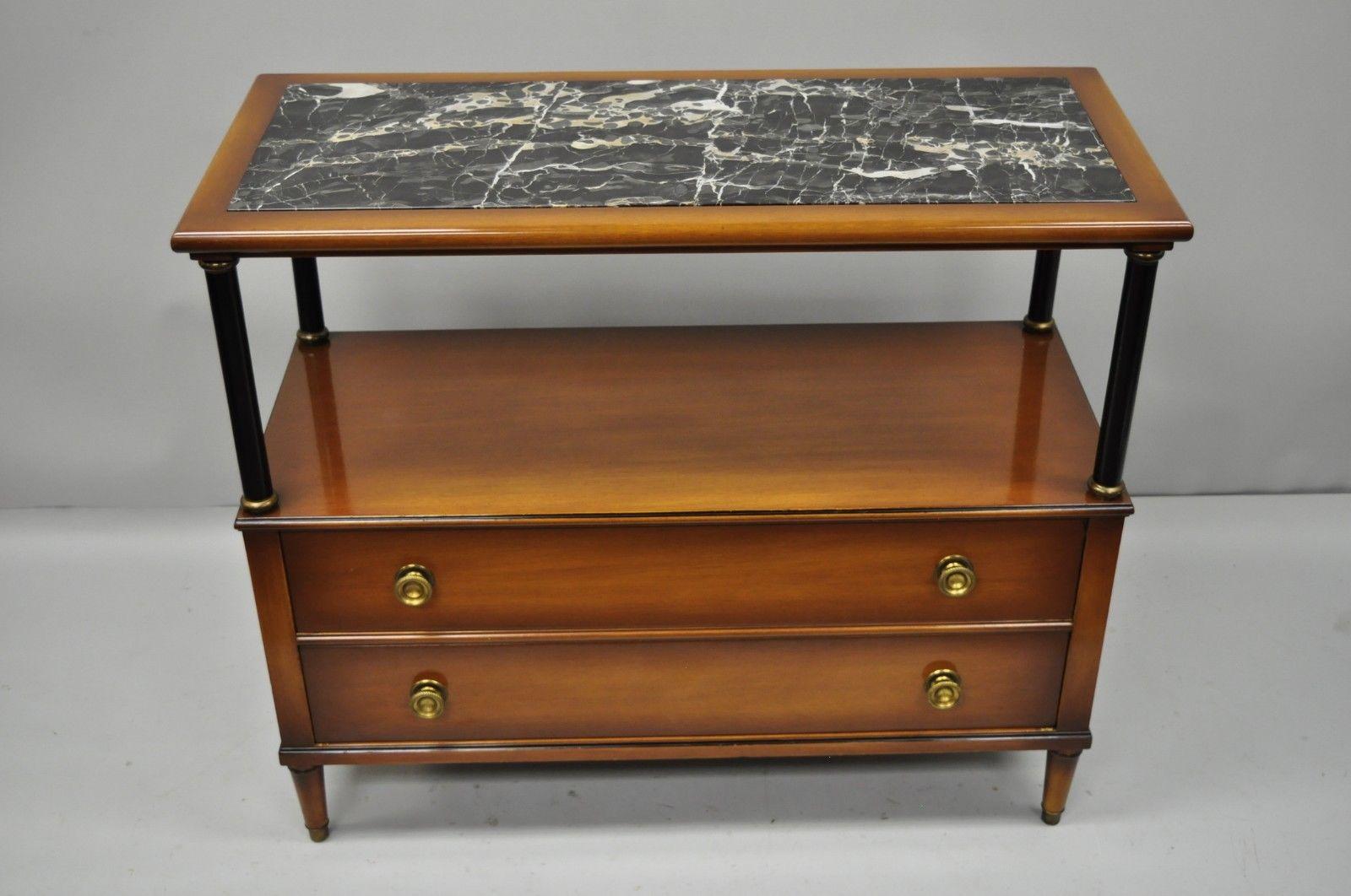 Maslow Freen French Empire style marble top server with black columns. Listing is for a single serving table. Matching server available in another listing. Item features inset marble top, black column support, brass capped feet, original label,