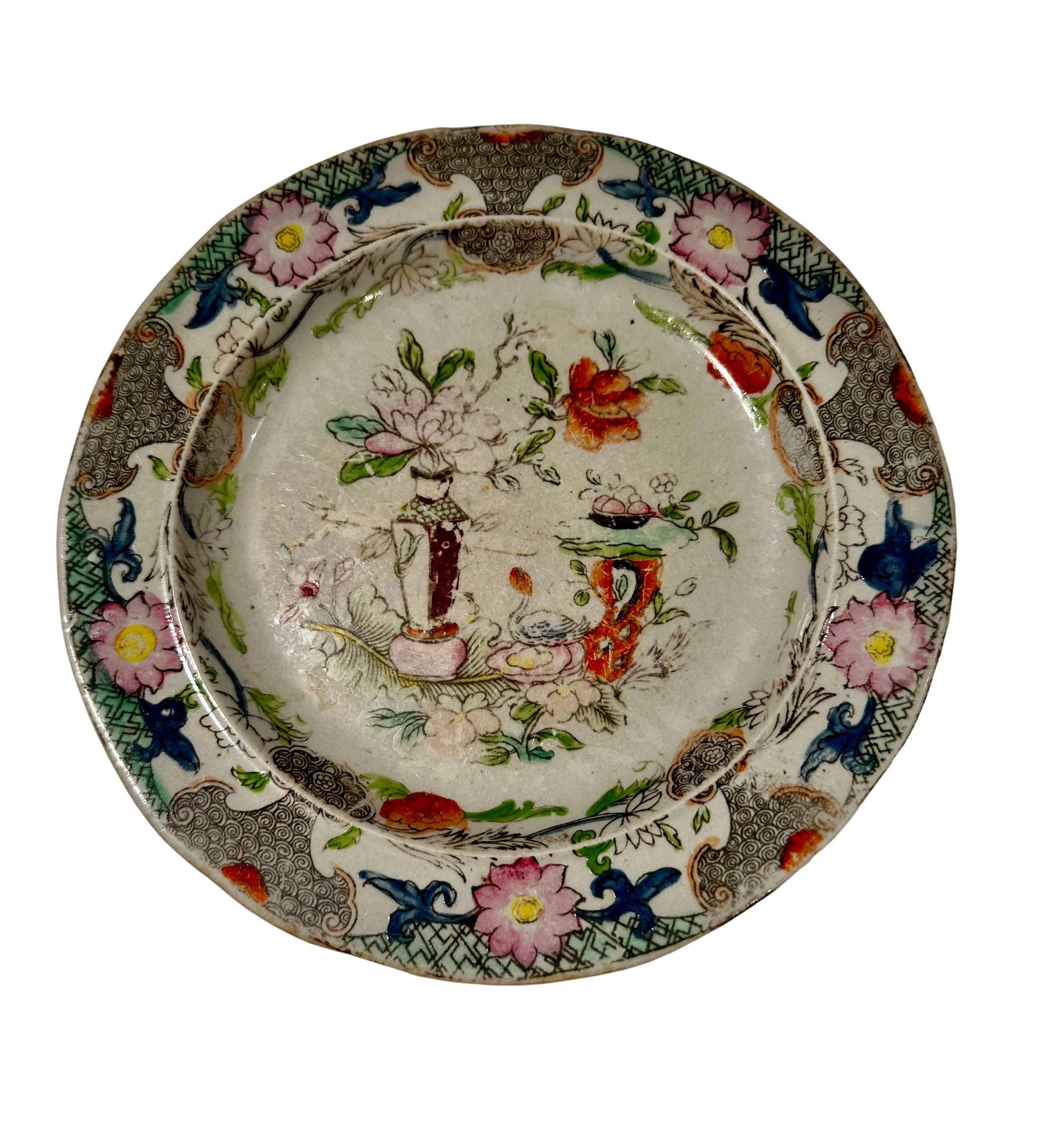 A set of five Mason Ironstone chinoiserie plates, table and flower pot. From a very prestigious, Atlanta antique shop call Jane Marsden.
