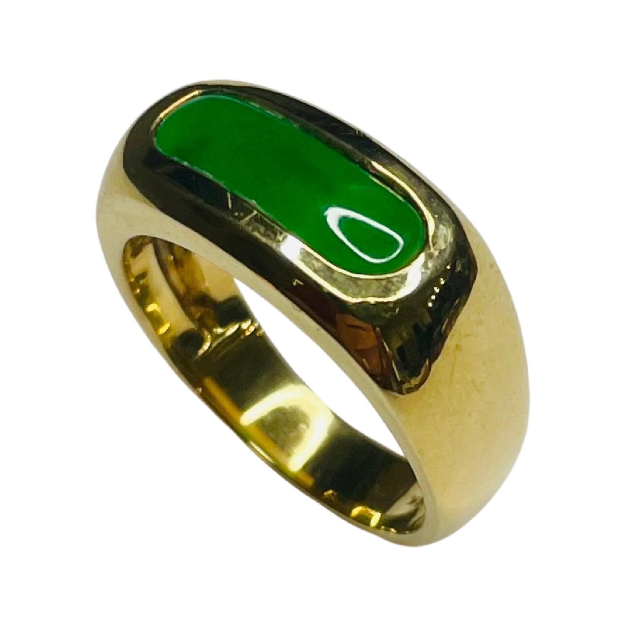 Mason Kay 18K Yellow Gold Ring with Natural Untreated Jadeite. The top of the saddle ring is 8.0 mm x  4.00 mm. The  shank is 5.15 mm  It is finger size 7.25,  but we can size it for an additional fee. 
100-70-544