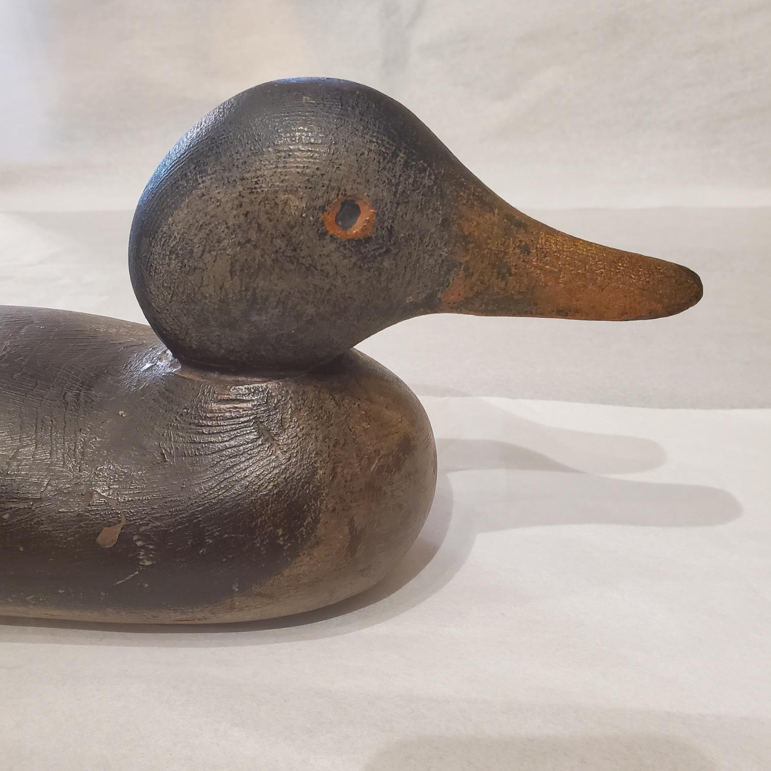 Antique Mason Standard Grade Painted Eye Mallard Hen Decoy, circa 1910, having head with carved and painted eyes, attached to solid carved body with slightly protruding breast. In mostly original paint with I think some old touch-up to the black