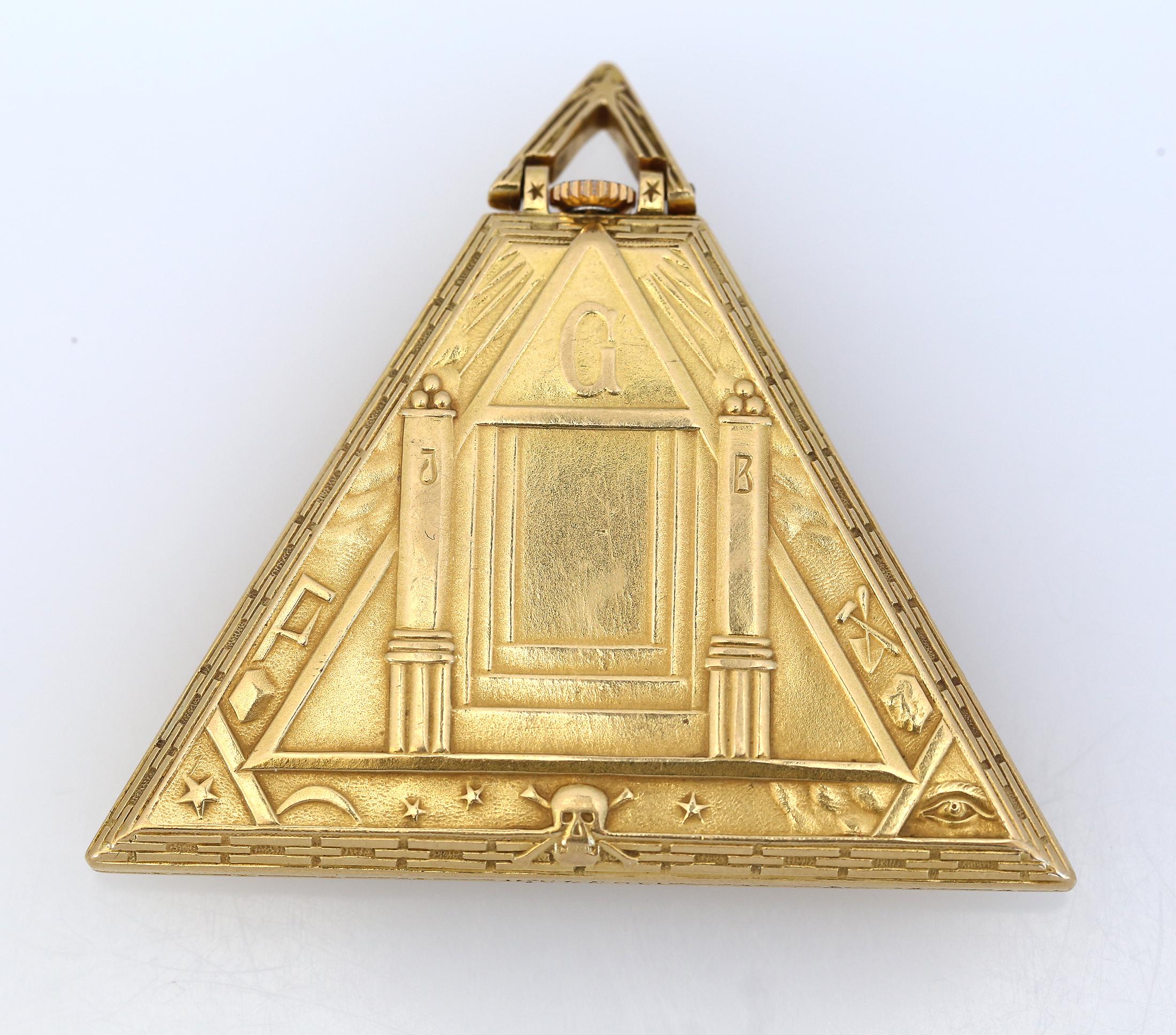 Art Deco Masoniс Triangle Pyramid Gold Watch Levrette Swiss, 1920

Extremely Rare Antique Masoniс Triangle Pyramid Gold Watch by Levrette Swiss. Highly collectable item, enamel dial with Masonic signs instead of numerals. Thermally blued hands look