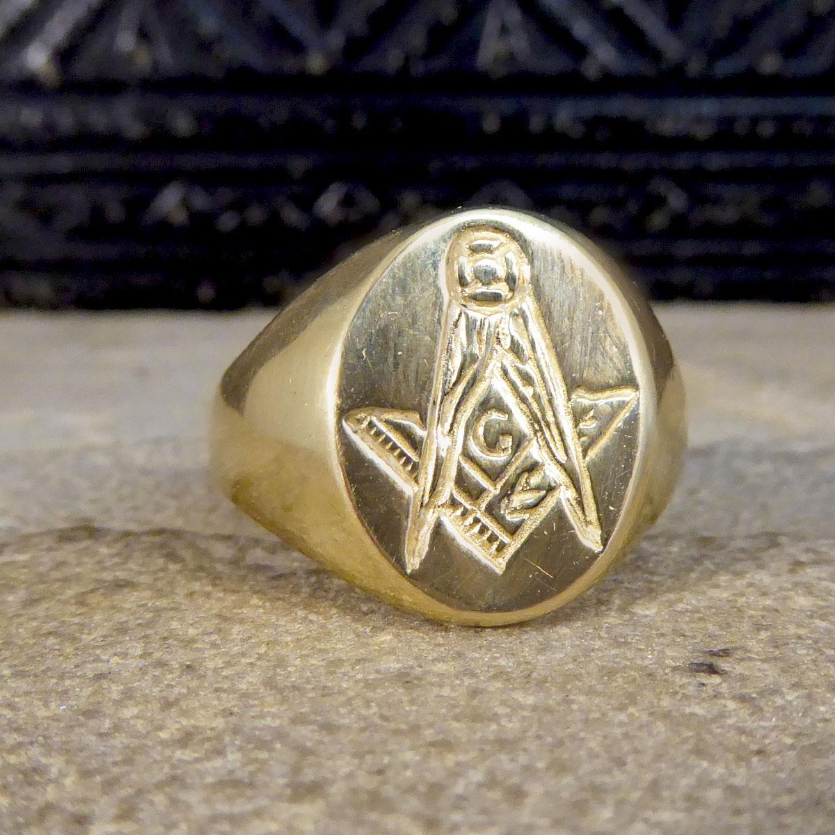 This vintage ring it typically worn by men as a gents signet but can also be worn my women as a unisex piece. This signet ring features a Masonic Compass engraving on the oval face and is quite large in size fully crafted from 9ct Yellow Gold.

Ring