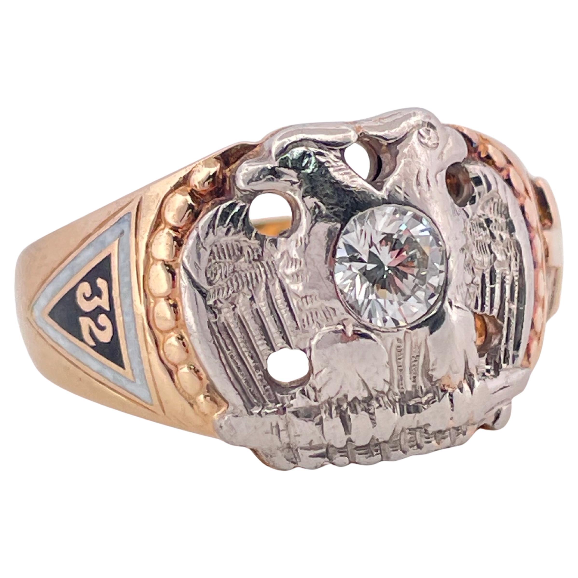 This distinguished Masonic 32nd Degree ring is finely crafted in solid 14k gold, weighing 12 grams, and measuring a size 11.5. At its center, a sparkling 0.38 carat round brilliant cut diamond is set within the detailed double-headed eagle, the