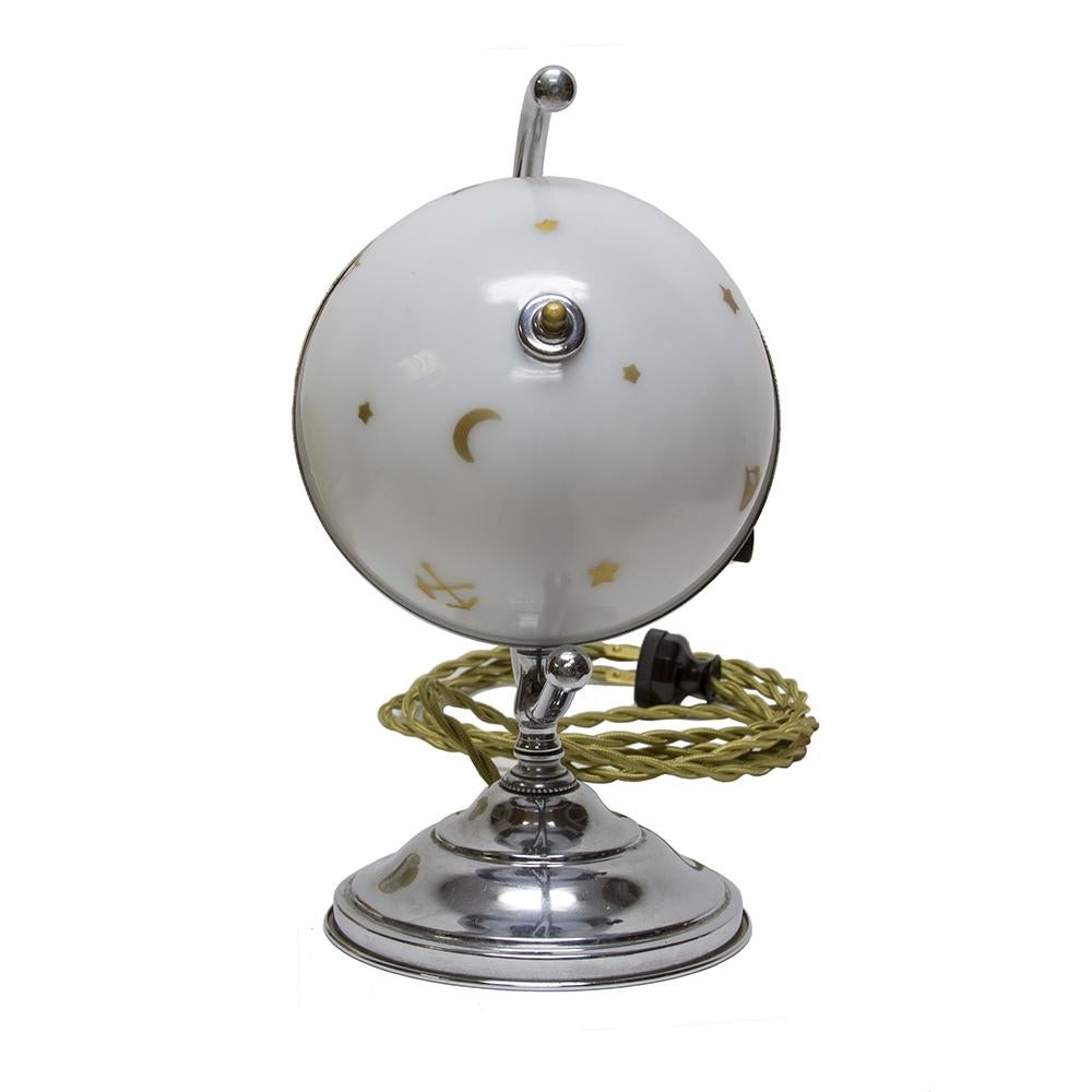 This beautiful little globe style desk lamp has a 1930s vintage and a fun array of masonic symbols painted on the glass. The shiny chrome base and stand accent the milk glass shade for a really great package.