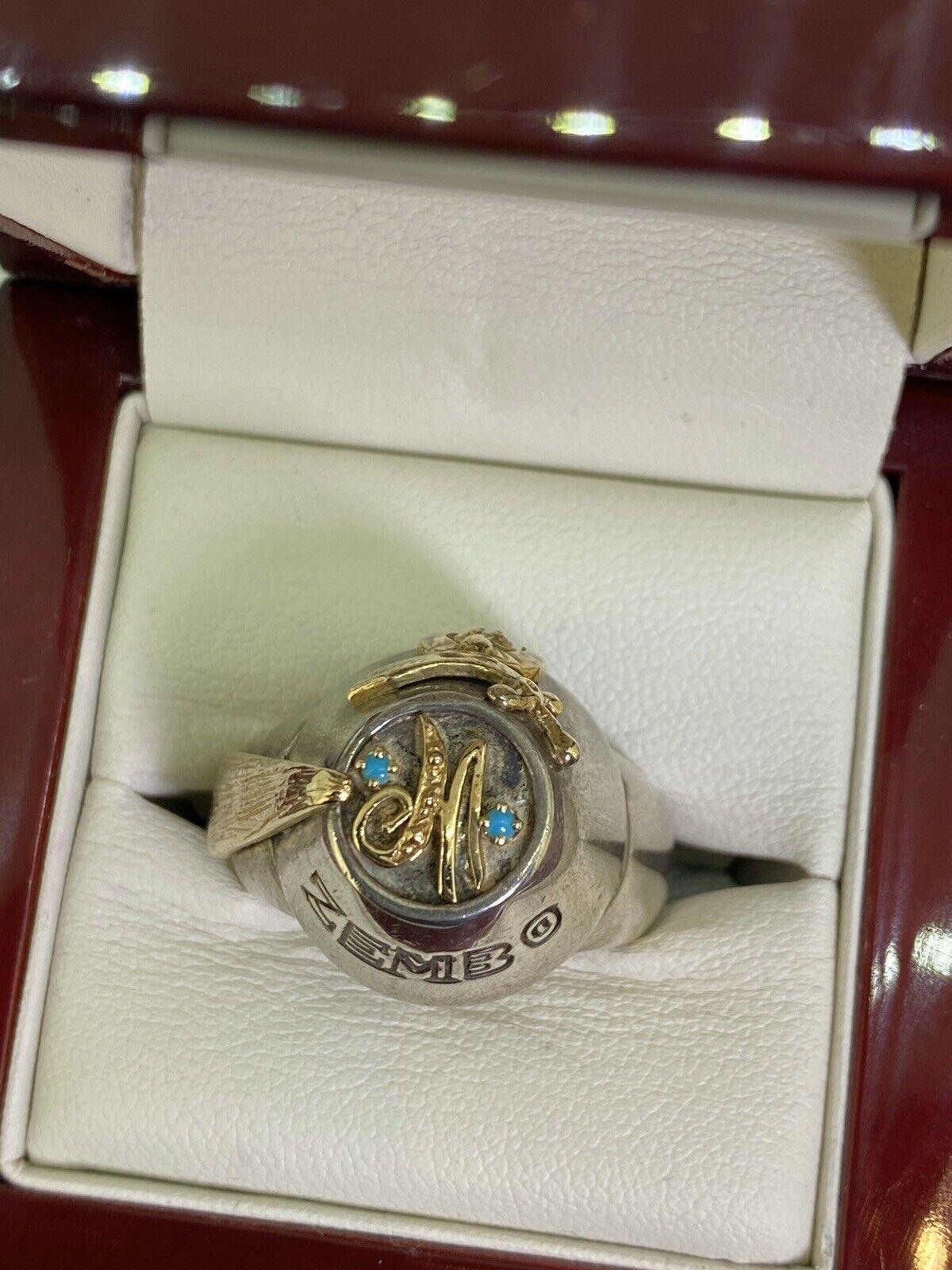 Masonic Shriners Antioch Design mens ring
set with 2 natural turquoises & round brilliant cut diamond
in 925 sterling silver with Gold Plated accents 

Total item’s weight: 20.4gr.
Ring’s size: U 1/2