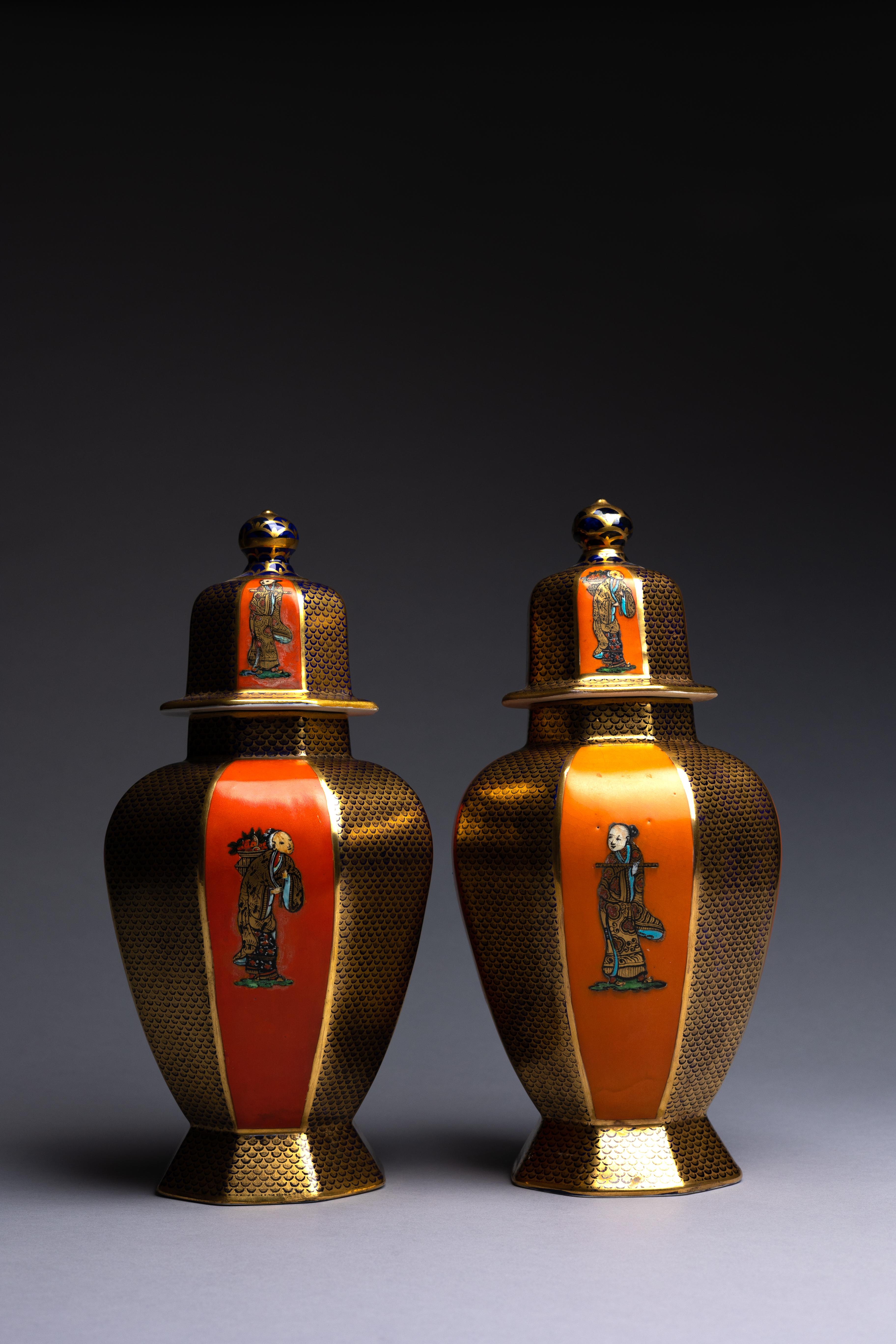 A 5-piece garniture of Mason's Ashworth ironstone vessels in orange, chinoiserie patterns. This garniture makes a striking statement with a bright orange glaze underneath cobalt, turquoise, and gold details.

The garniture comprises:
-A pair of