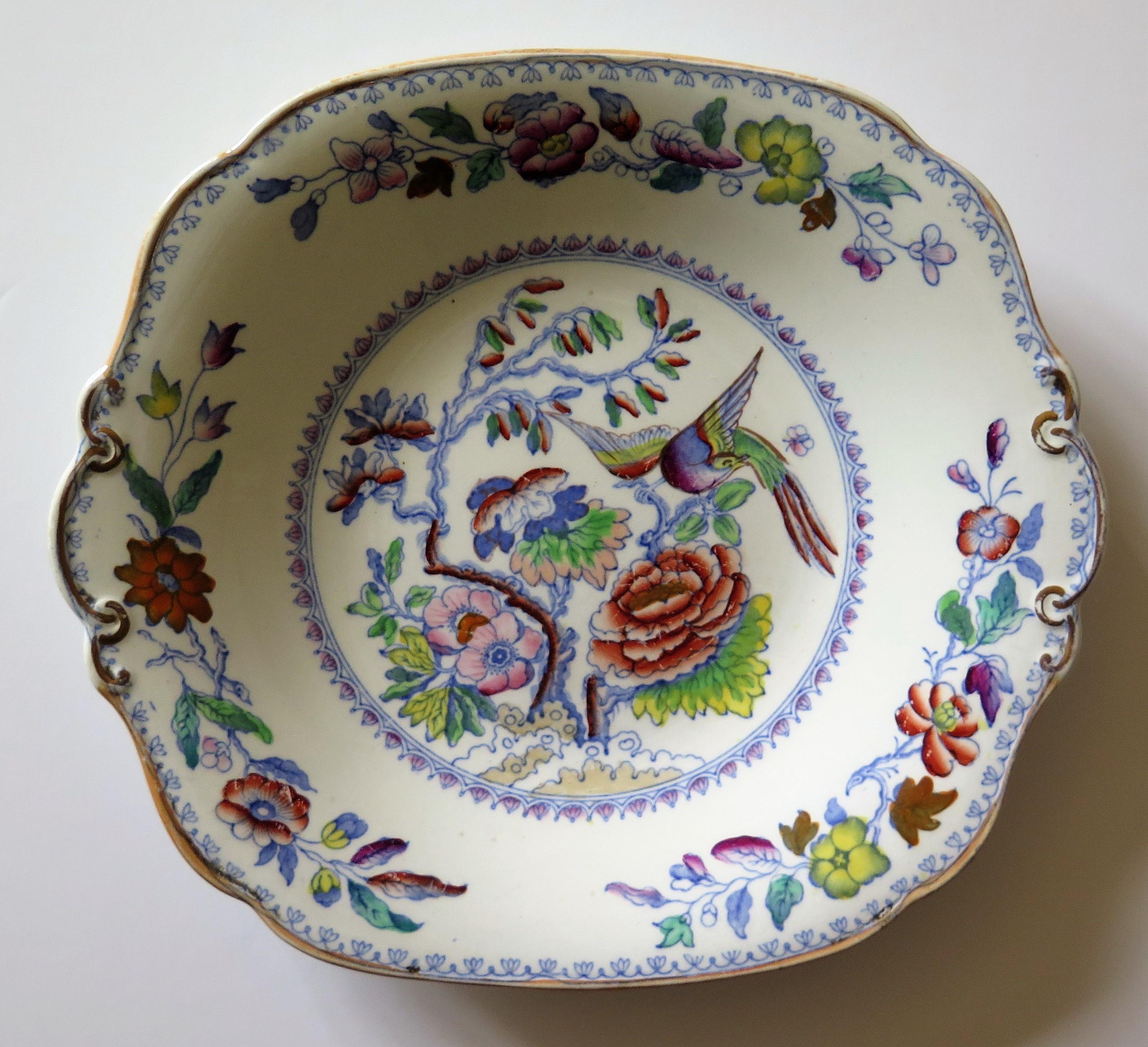 This is an ironstone desert dish or plate in the flying bird pattern, made by Mason's Ironstone of Lane Delph, Staffordshire, England, during the 19th century, circa 1880.

The dish or plate is rectangular in shape with a wavy rim having two