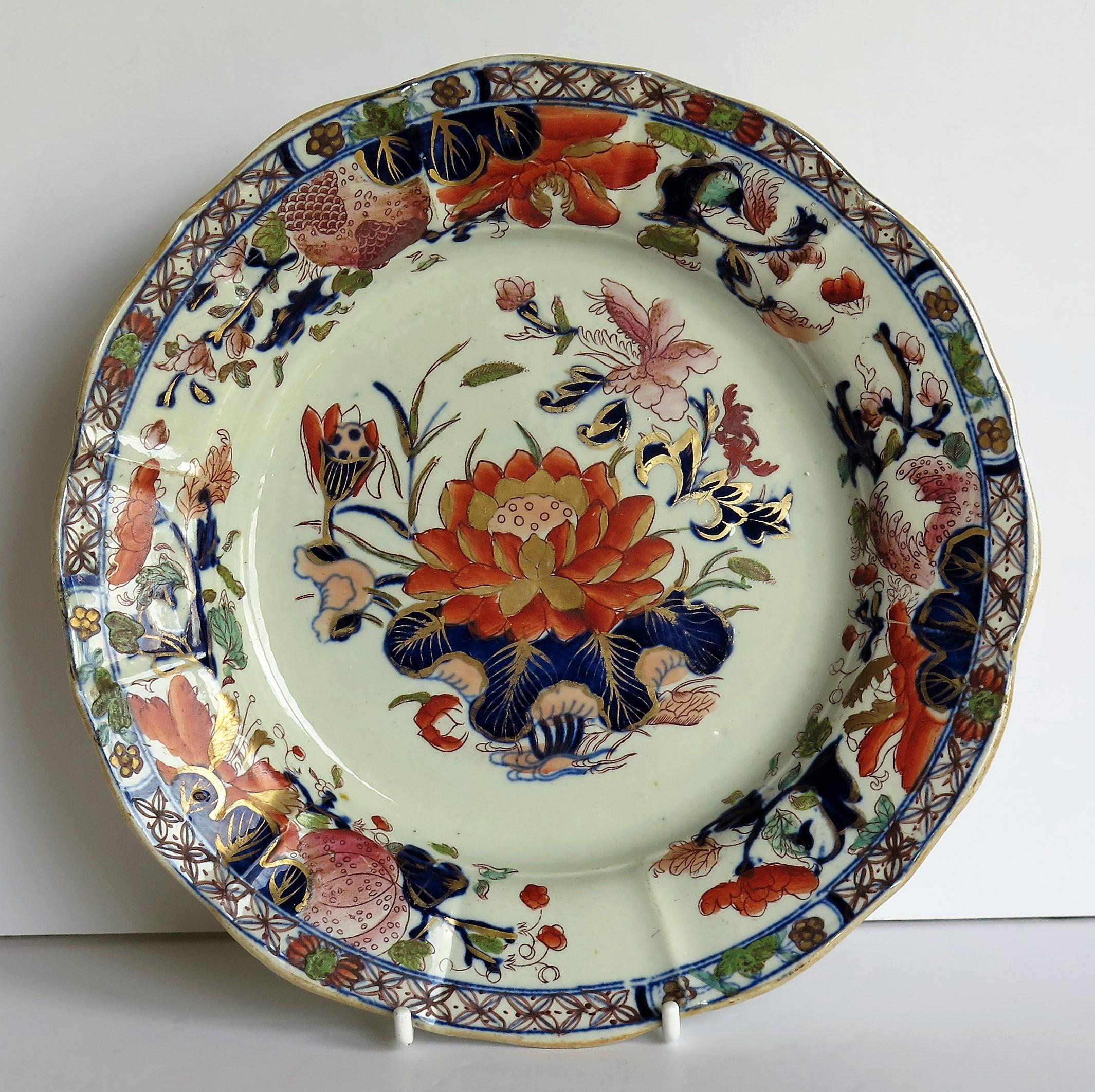 These is a good early Mason's Ironstone pottery deep Pplate or dish in the very decorative Water Lily pattern, produced by the Mason's factory at Lane Delph, Staffordshire, England, circa 1815.

The plate is circular with radial ribs and a