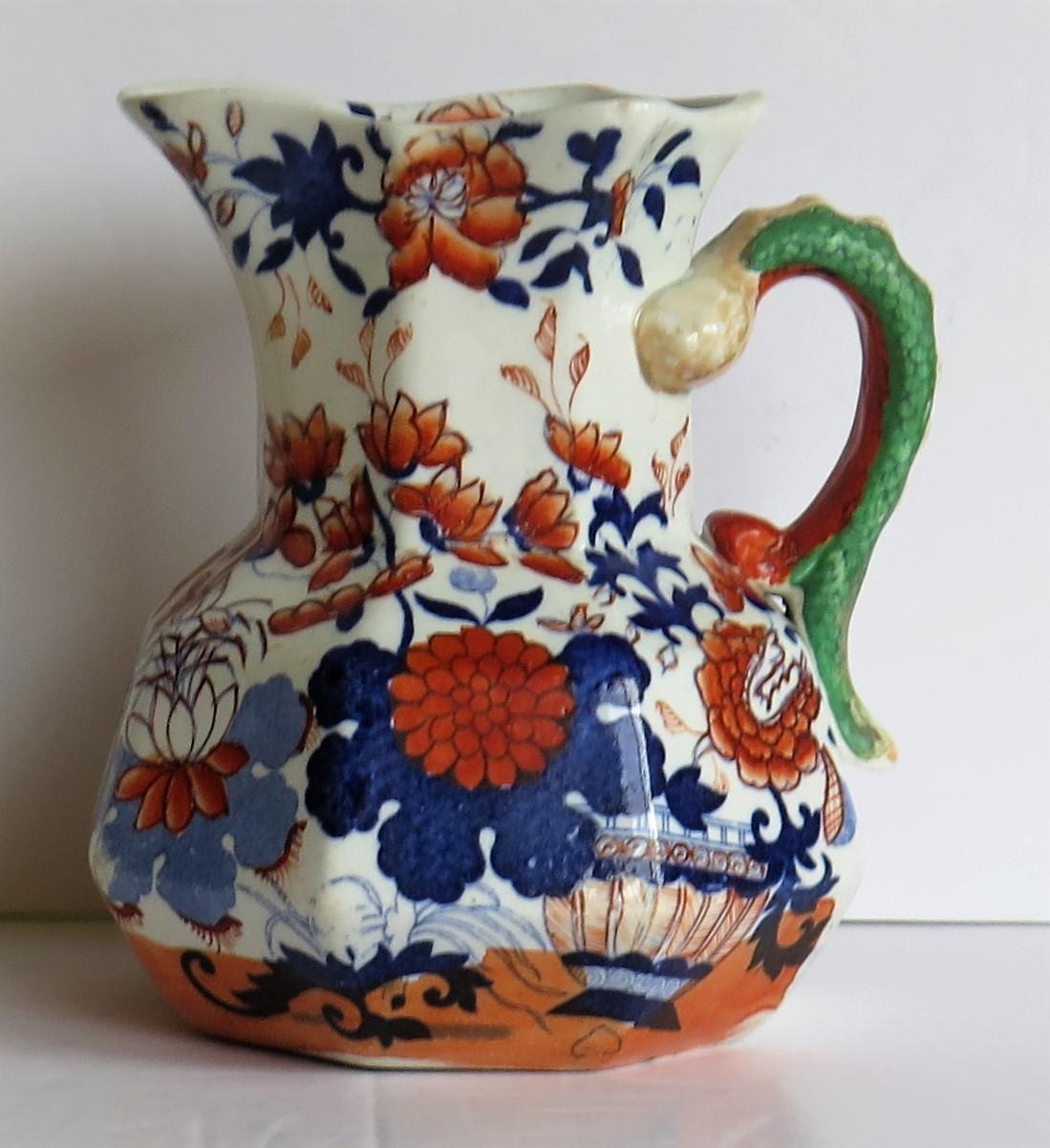This is a very good, Mason's Ironstone Hydra jug or pitcher in the basket Japan pattern, made in the English, William 1Vth or early Victorian period, circa 1830-1848.

The jug has an octagonal shape with a notched snake handle and is decorated in
