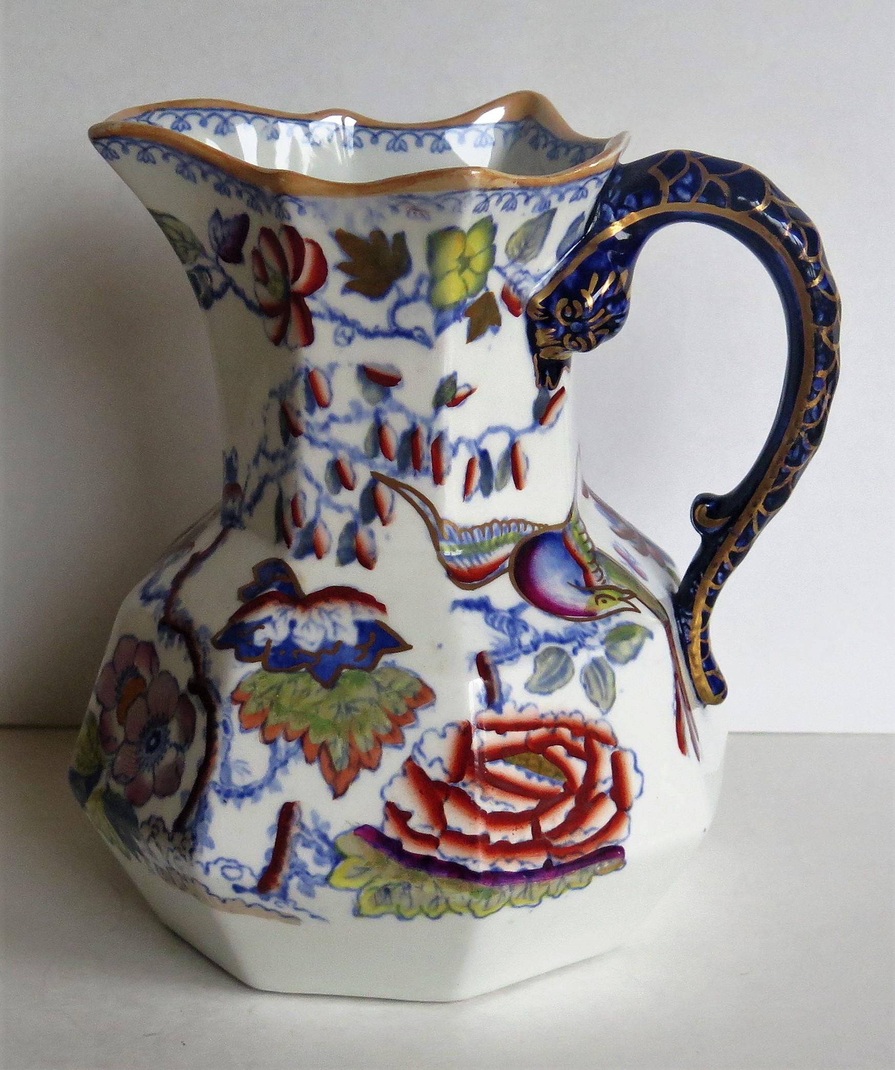 This is a very good mid size Hydra Jug or Pitcher by Mason's Ironstone, England, circa 1870.

The jug has an octagonal form in the hydra shape with a looping snake handle. 

This jug has one of the very decorative oriental, chinoiserie patterns