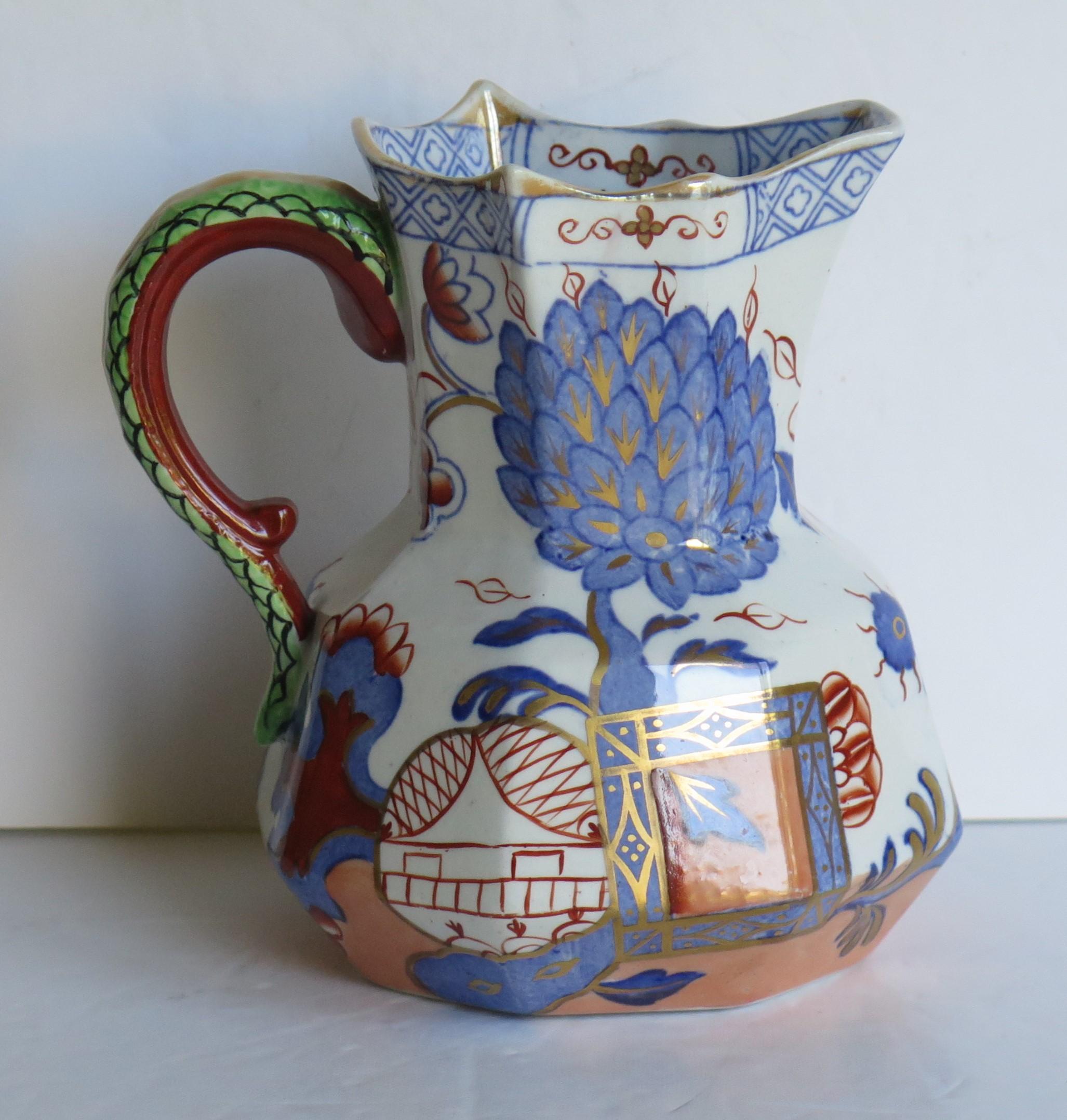 This is a very good Ironstone hydra jug or pitcher in the jardinière pattern and made by Mason's Ironstone, England, circa 1870.

The pattern is a known Mason's chinoiserie pattern called 