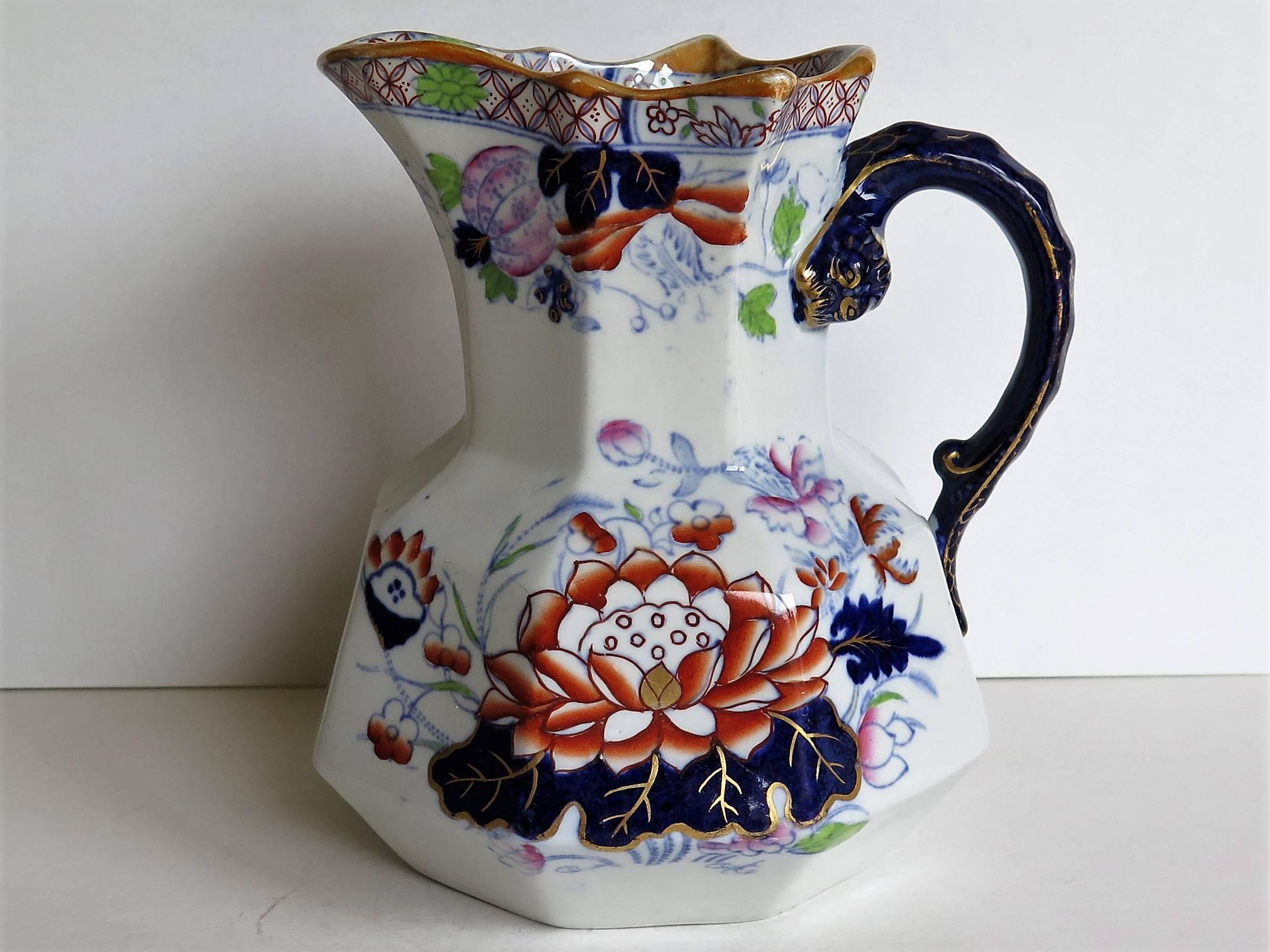 This is a very good jug or pitcher by Mason's ironstone, England, circa 1880.

The jug has the Hydra shape with the snake heads handle with lower spur. 

This jug has one of the very decorative and sought after oriental, Chinoiserie patterns