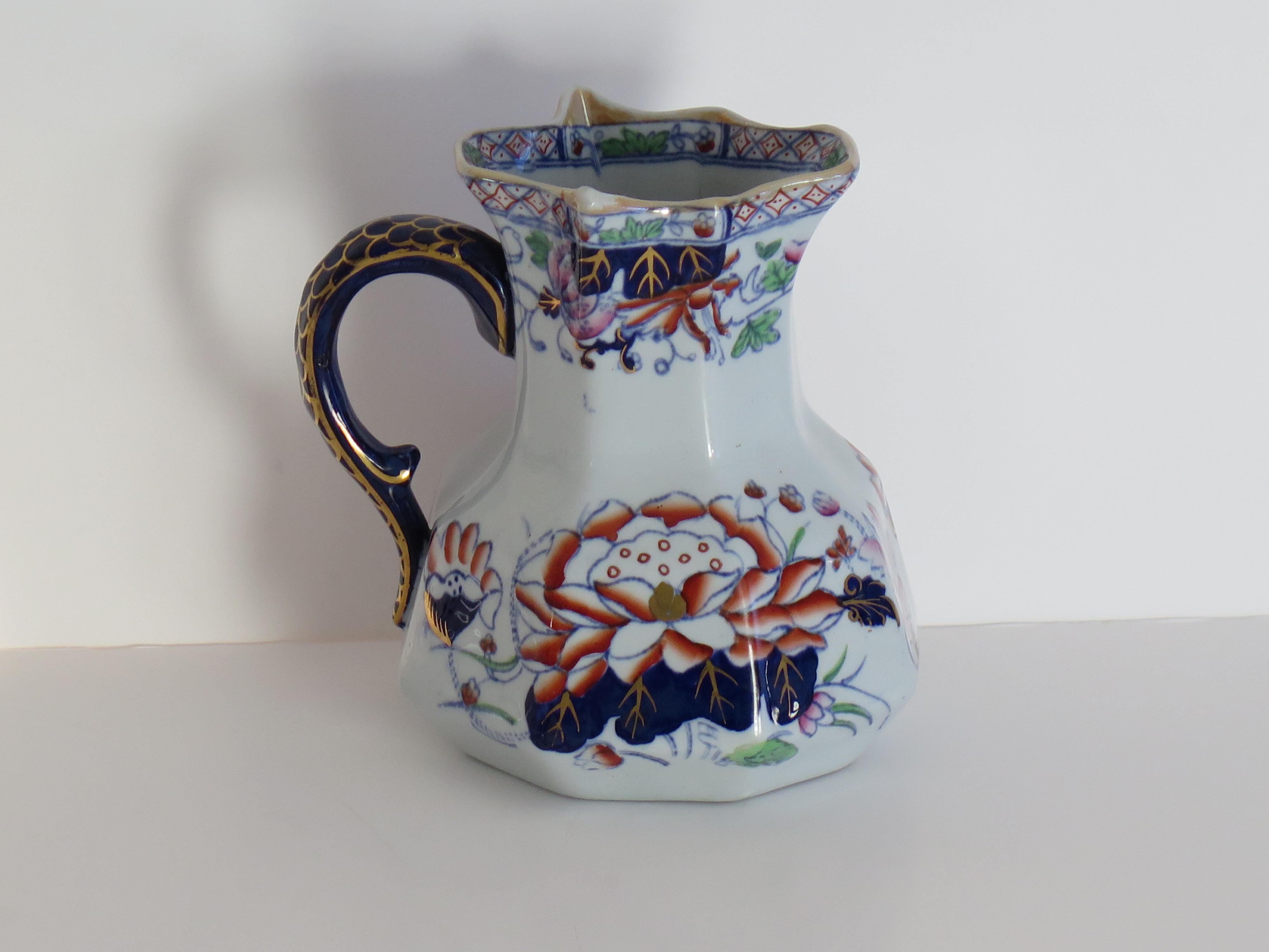 This is a very good jug or pitcher by Mason's ironstone, England, circa 1880.

The jug has the Hydra shape with the snake heads handle with lower spur. 

This jug has one of the very decorative and sought after oriental, Chinoiserie patterns called