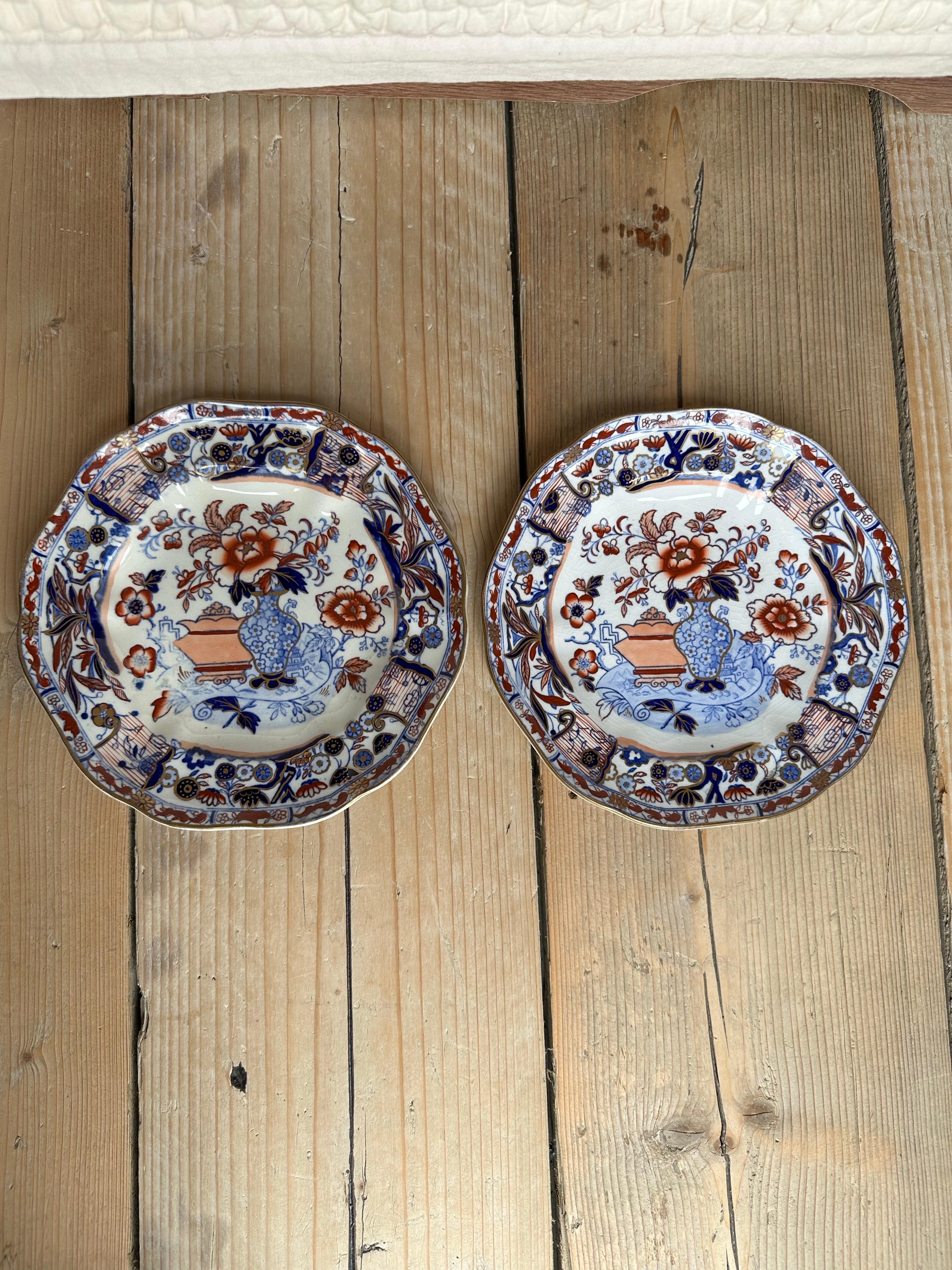 An exquisite example of English ceramic artistry, this Mason’s Ironstone plate is decorated in the richly layered Imari palette of deep cobalt blue, iron red, and hand-applied gilding. Made in England in the early to mid-1800s, this piece combines