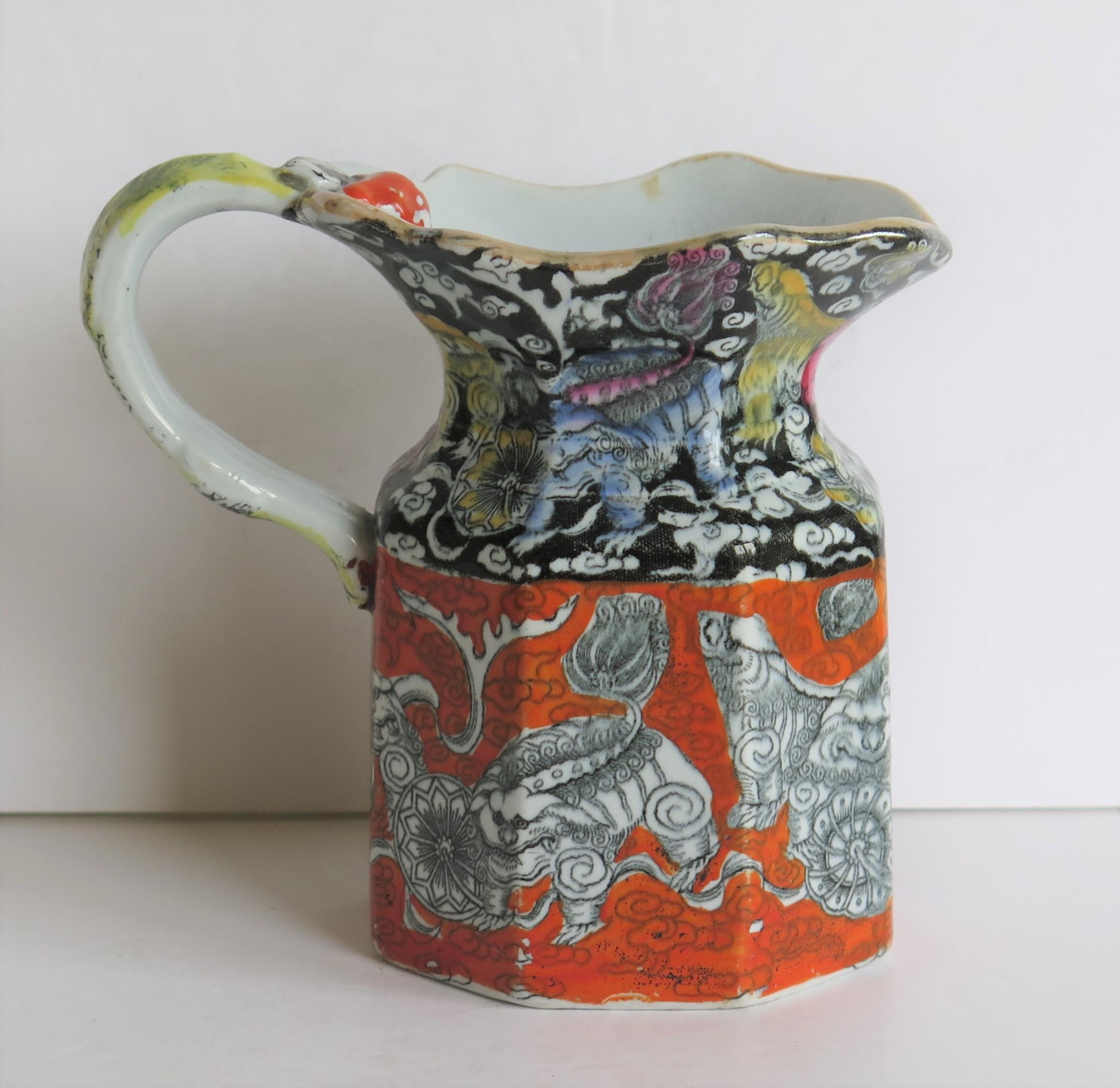 This is a very decorative Jug or Pitcher by Mason's Ironstone pottery, in the striking Bandana pattern, made in the mid-19th century, Circa 1840. 

The jug is hand decorated over a transfer printed pattern with the striking chinoiserie influenced
