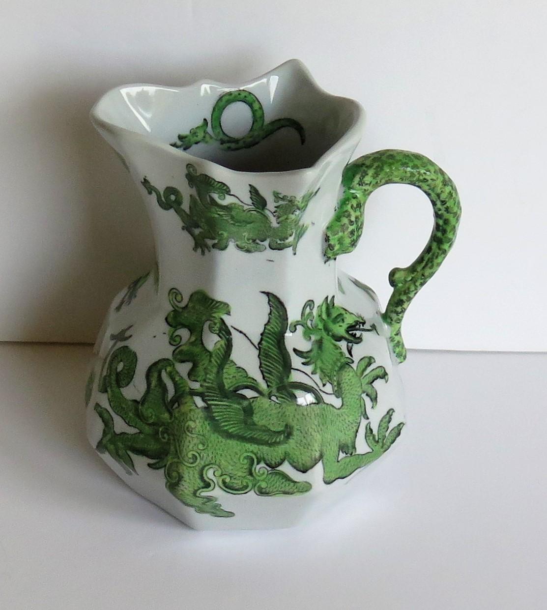 This is a very good Hydra jug or pitcher, made by Mason's Ironstone, England in the Chinese Dragon Pattern and dating to the 19th century, circa 1880.

The jug is octagonal in shape with the snake handle. These jugs were made in a range of sizes,