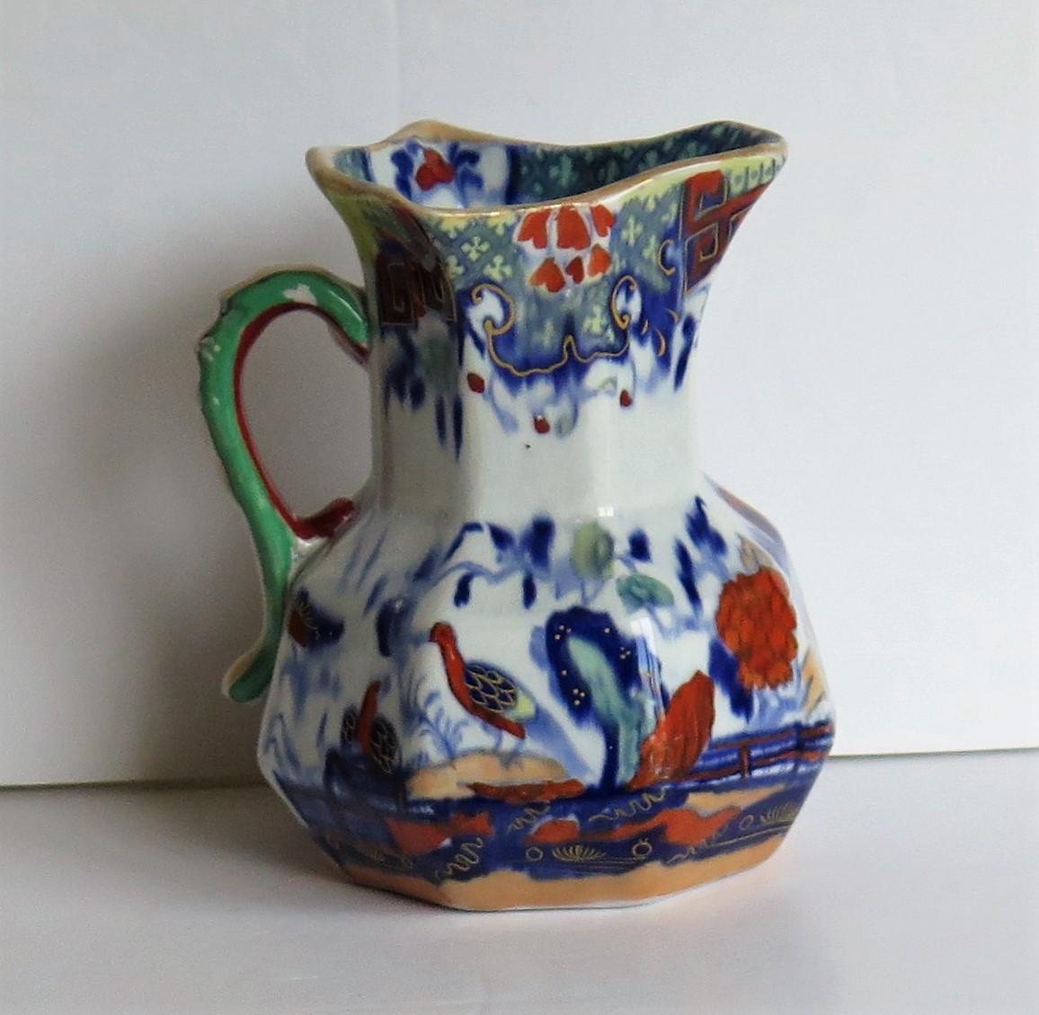 This is a very good Hydra jug or pitcher, made by Mason's Ironstone, England in the RARE Heron pattern and fully marked to the base, dating it to circa 1830

The jug is octagonal in shape with the snake handle. These jugs were made in a range of