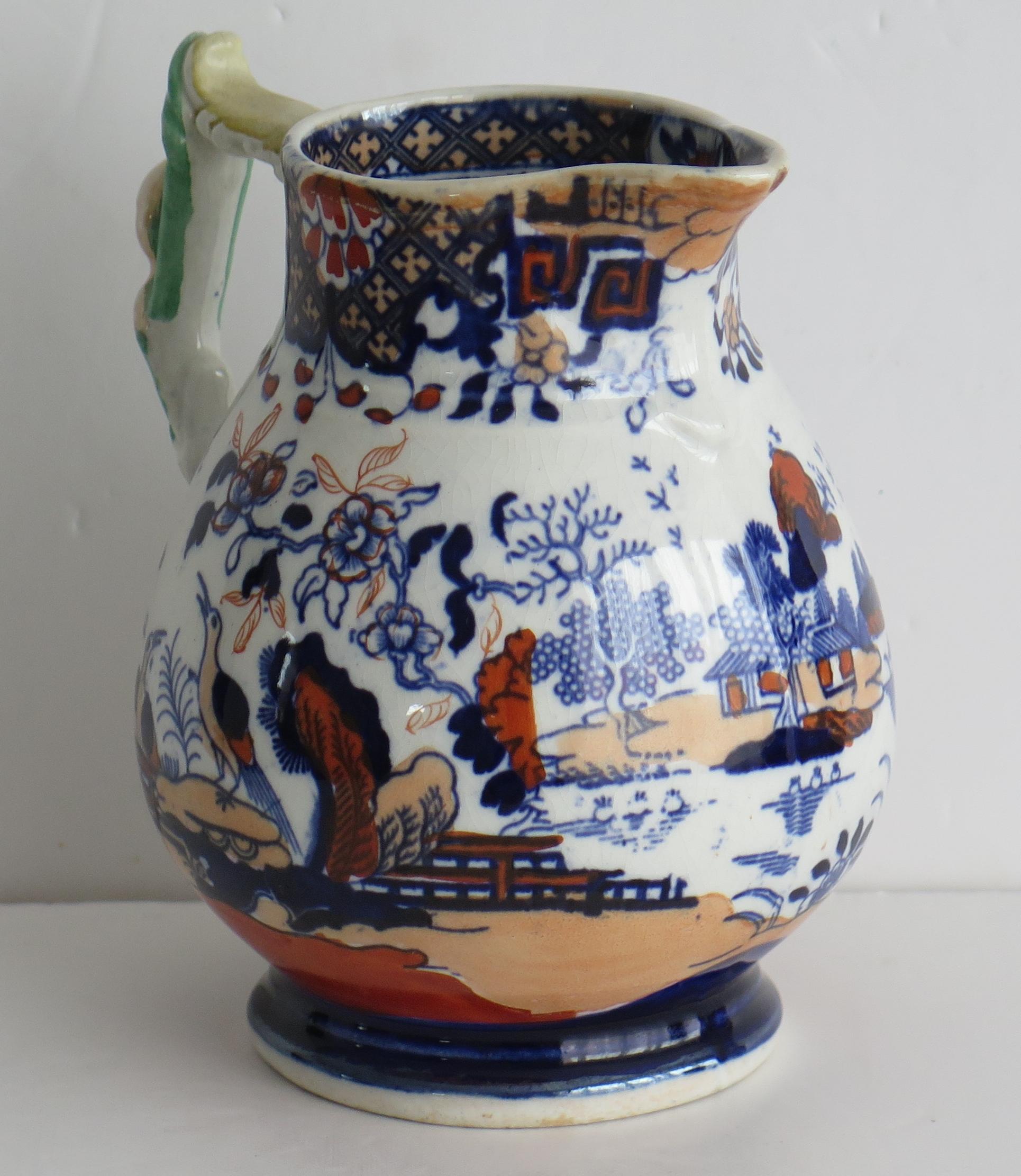 This is a very good rare shaped jug or pitcher, made by Mason's Ironstone, England in the Rare Heron pattern and fully marked to the base, dating it to circa 1830

The jug has a rare shaped baluster form on a low foot and an unusual loop handle