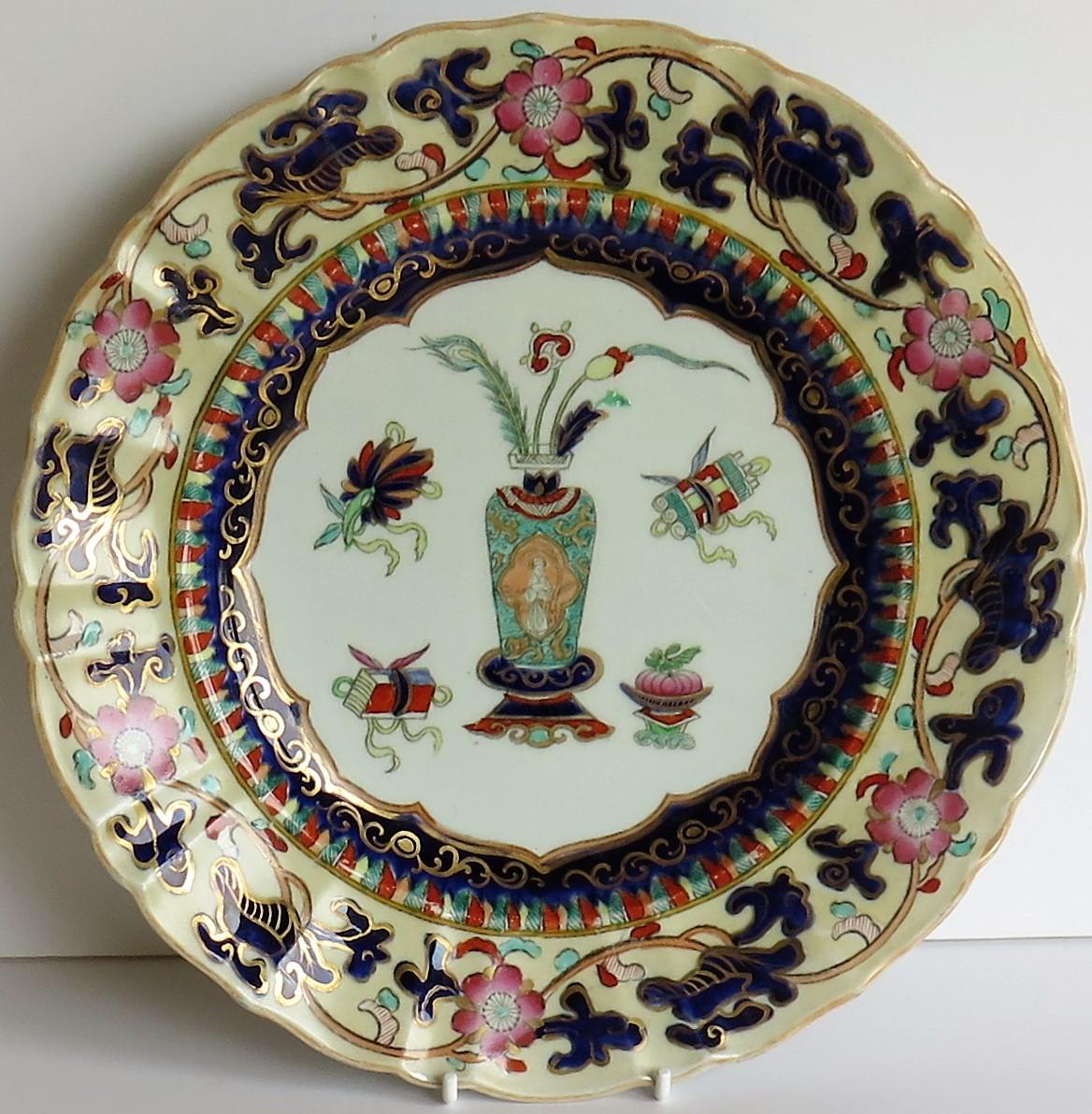 This is a good ironstone dinner plate made by Mason's Ironstone, Lane Delph, England, hand painted and gilded in the Chinese Antiquities pattern and dating to the 19th century, circa 1840.

The plate is beautifully and boldly decorated in the