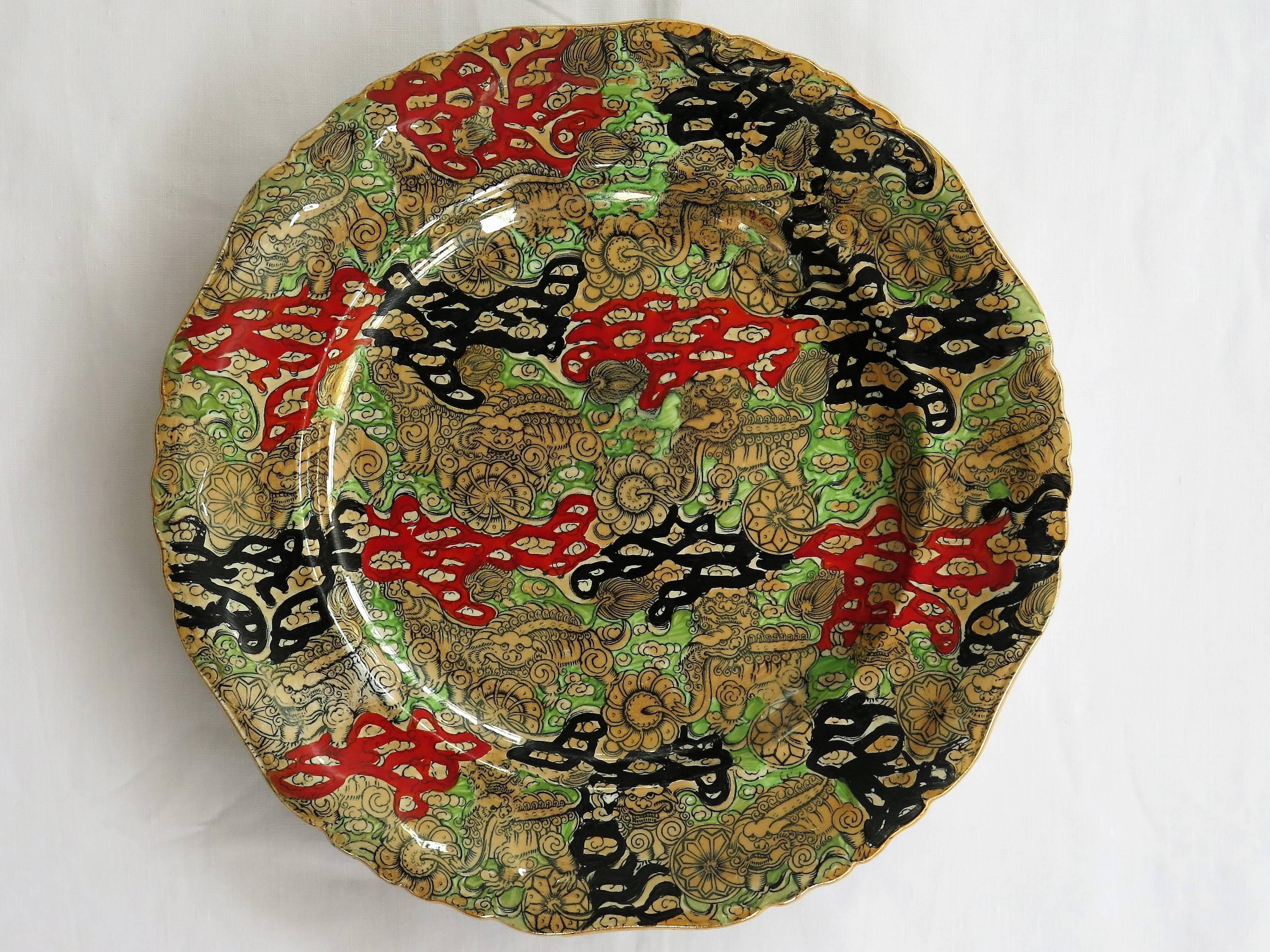 This is a very good, large dinner plate by Mason's ironstone, England in the Bandana pattern, dating to circa 1870. 

The Plate is circular in shape with a wavy moulded edge.

This plate has one of the sought after chinoiserie patterns called