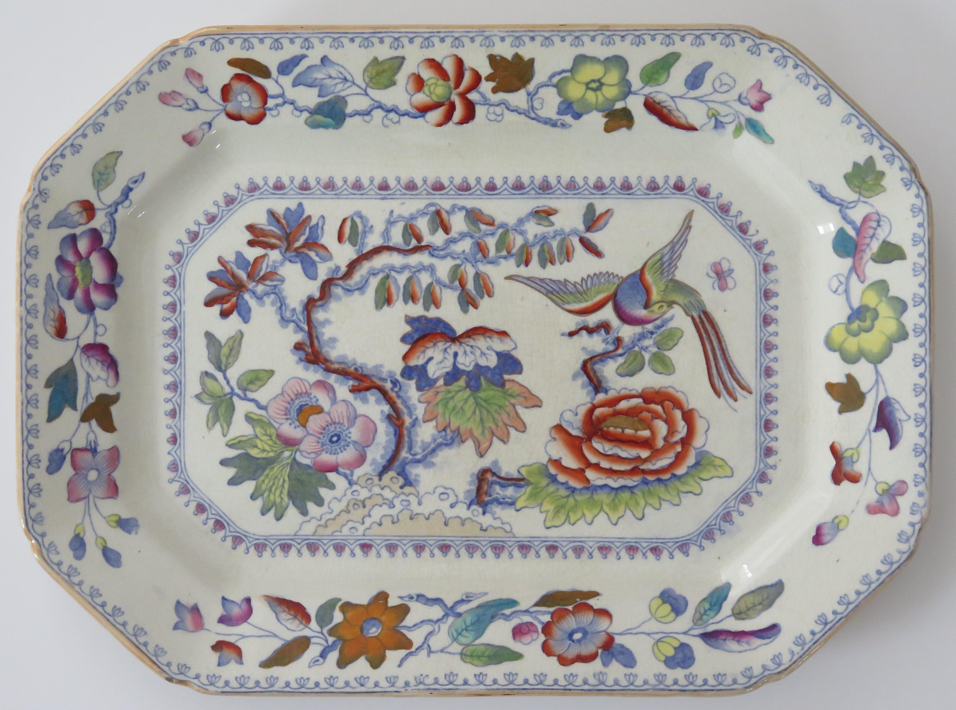 This is an ironstone large platter or meat plate in the flying bird pattern, made by Mason's Ironstone of Lane Delph, Staffordshire, England, during the 19th century, circa 1880.

The plate is rectangular in shape with canted corners, making an