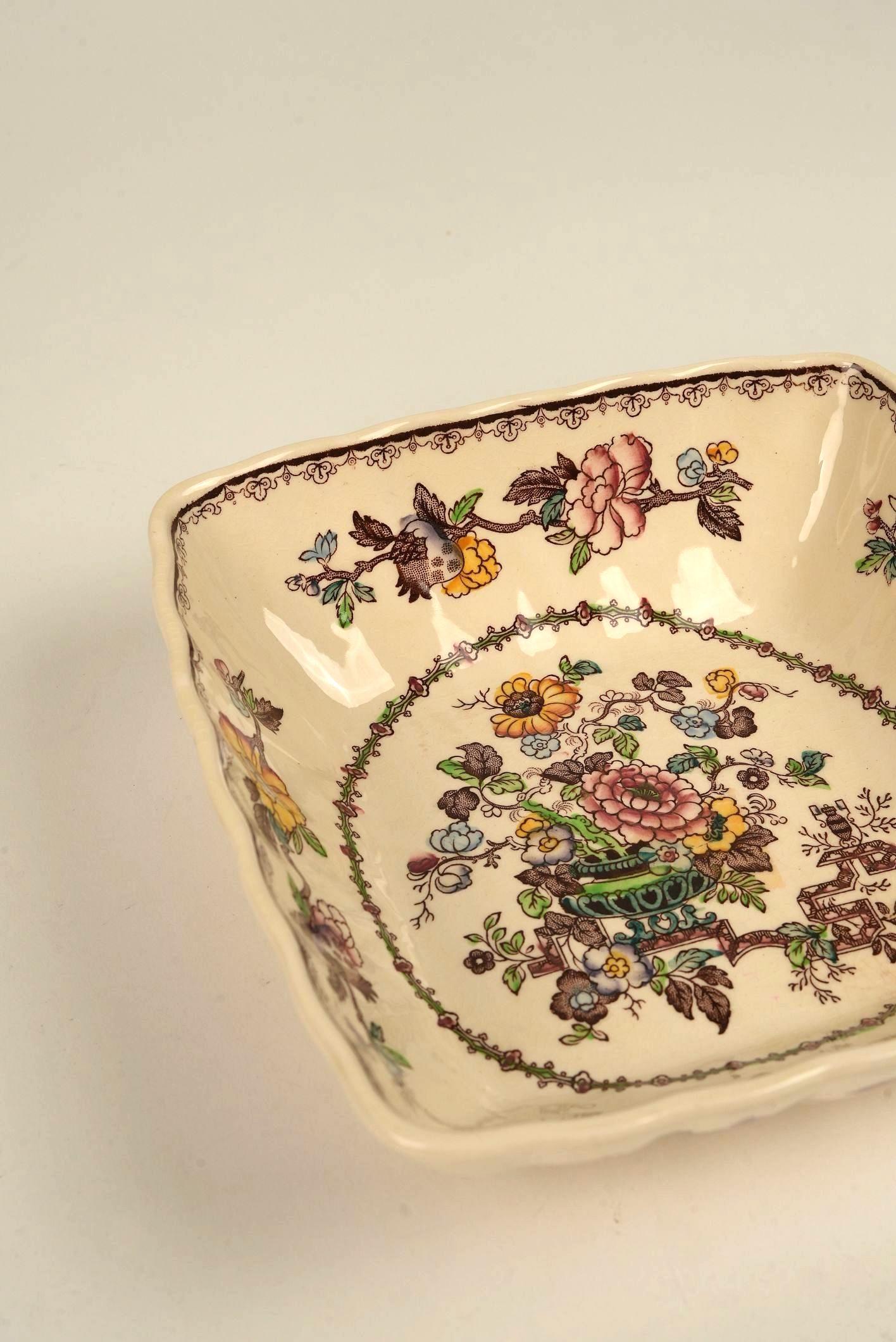This antique Mason’s Ironstone square bowl in the Nabob pattern is a rare and collectible piece that embodies the craftsmanship and cultural aesthetics of early 19th-century England. Its distinct square form alone makes it stand out—geometric yet