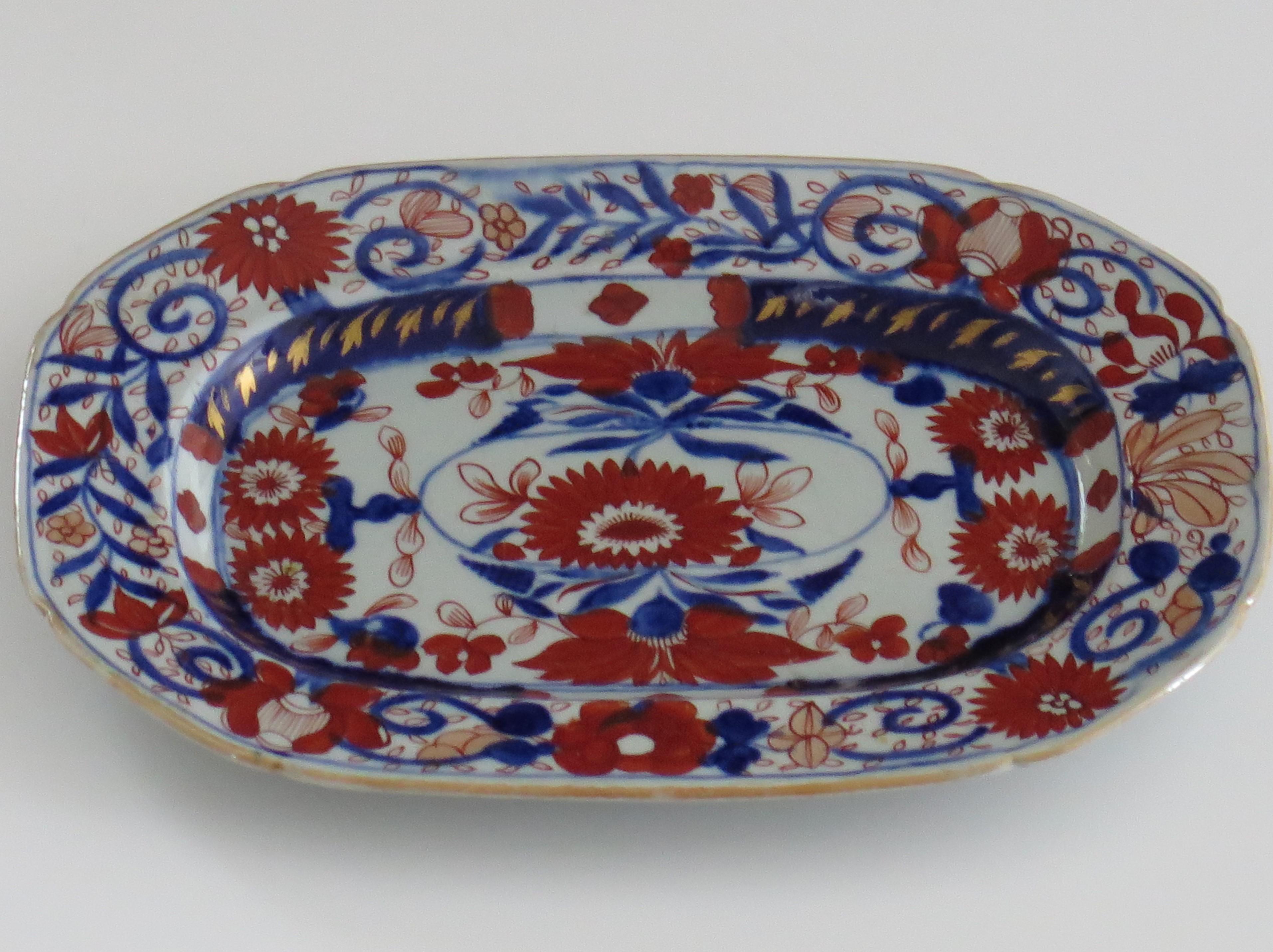 This is a very decorative small rectangular serving platter by Mason's Ironstone, Lane Delph, England in the stylised Chrysanthemum pattern, dating to the very early period of Mason's ironstone, circa 1818.

The platter or dish is rectangular in