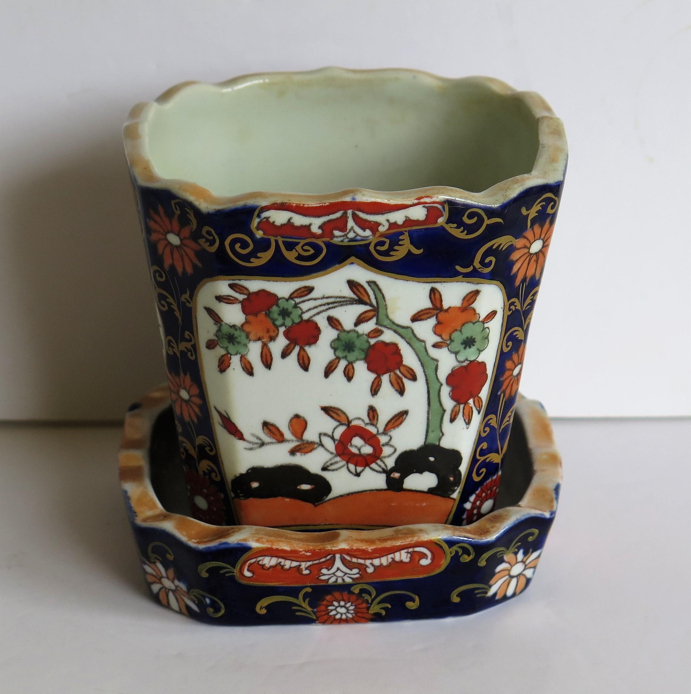 This is an ironstone Jardinière or Plant Pot complete with under-tray or stand in the blue Hawthorne and fence and bowl pattern, made by Mason's Ironstone of Lane Delph, Staffordshire, England, during the first half of the 19th century, circa