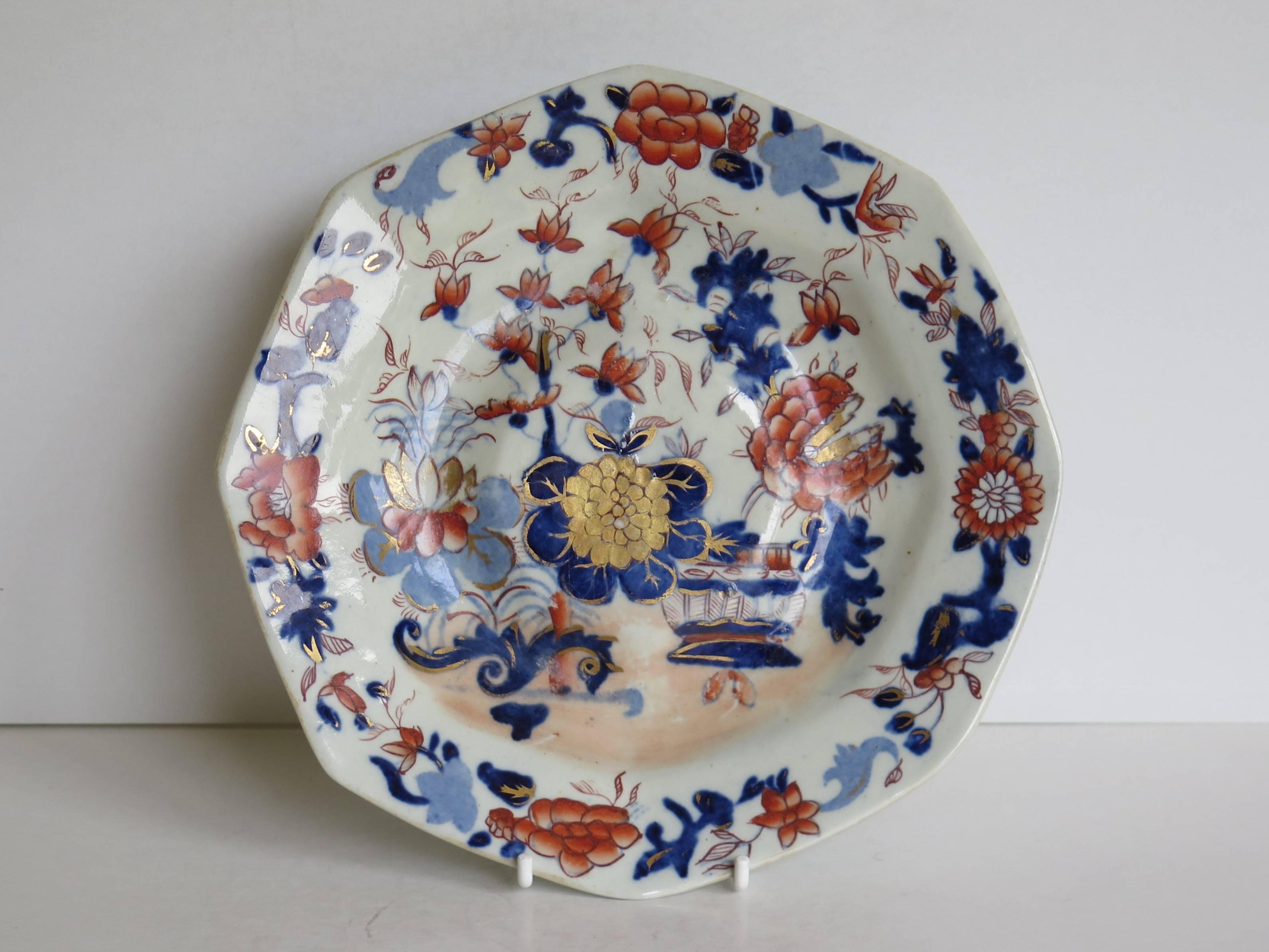 This is a very early octagonal footed plate, dish or stand in the Japan Basket Pattern by Mason's Ironstone, Lane Delph, England, dating to circa 1815.

The piece is octagonally potted on a raised foot with a slightly raised central
