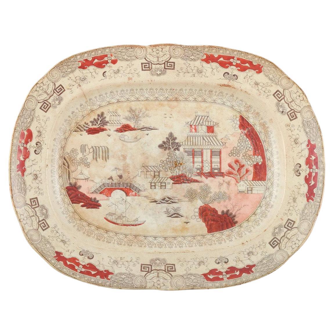 Mason
s. Grand plat ovale en céramique avec des motifs d
inspiration chinoise, C.I.C.